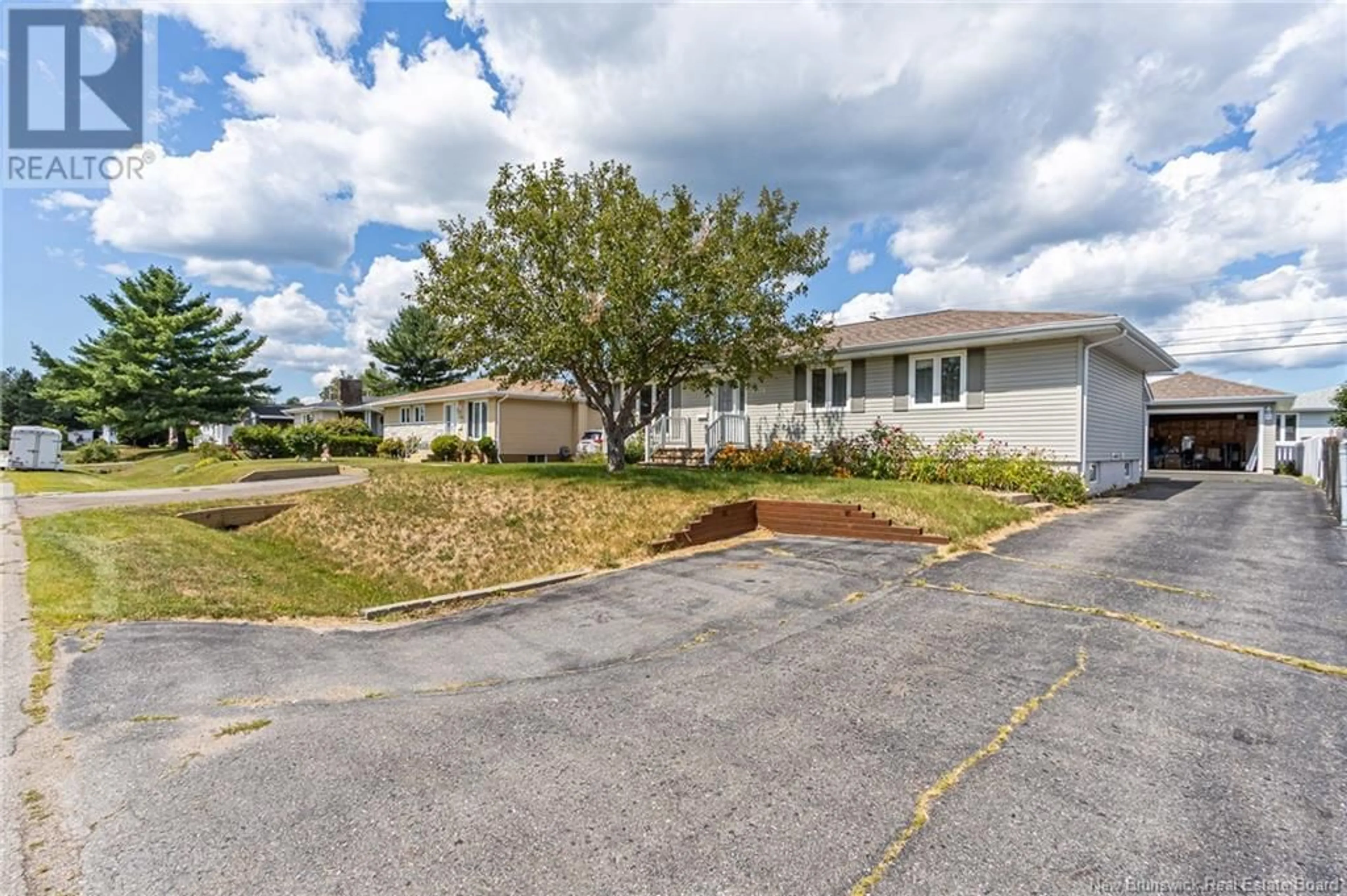 A pic from outside/outdoor area/front of a property/back of a property/a pic from drone, street for 1130 ROCKLAND DRIVE, Bathurst New Brunswick E2A3T9