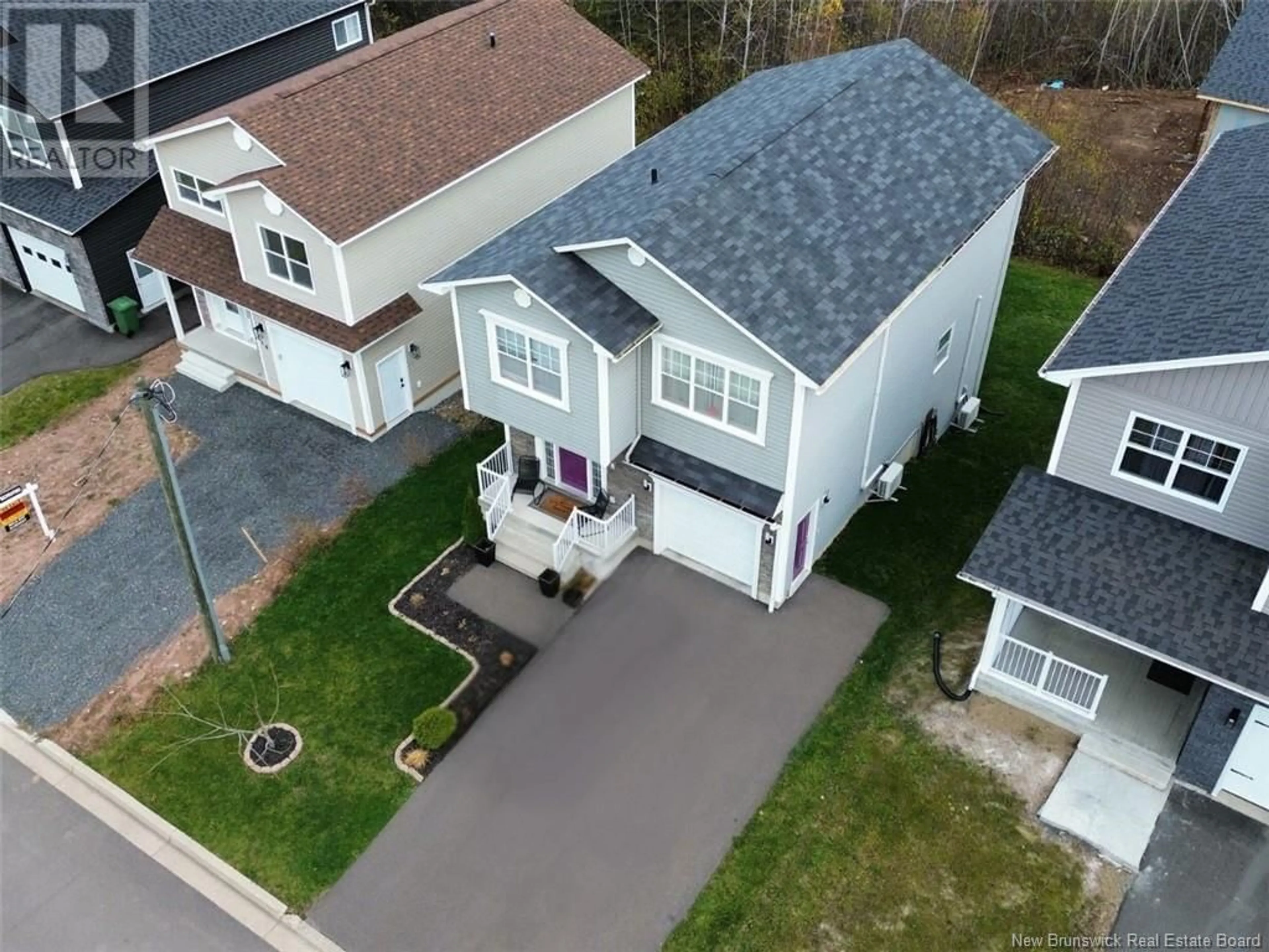 A pic from outside/outdoor area/front of a property/back of a property/a pic from drone, street for 8 Sylvya Court, Fredericton New Brunswick E3B0T3