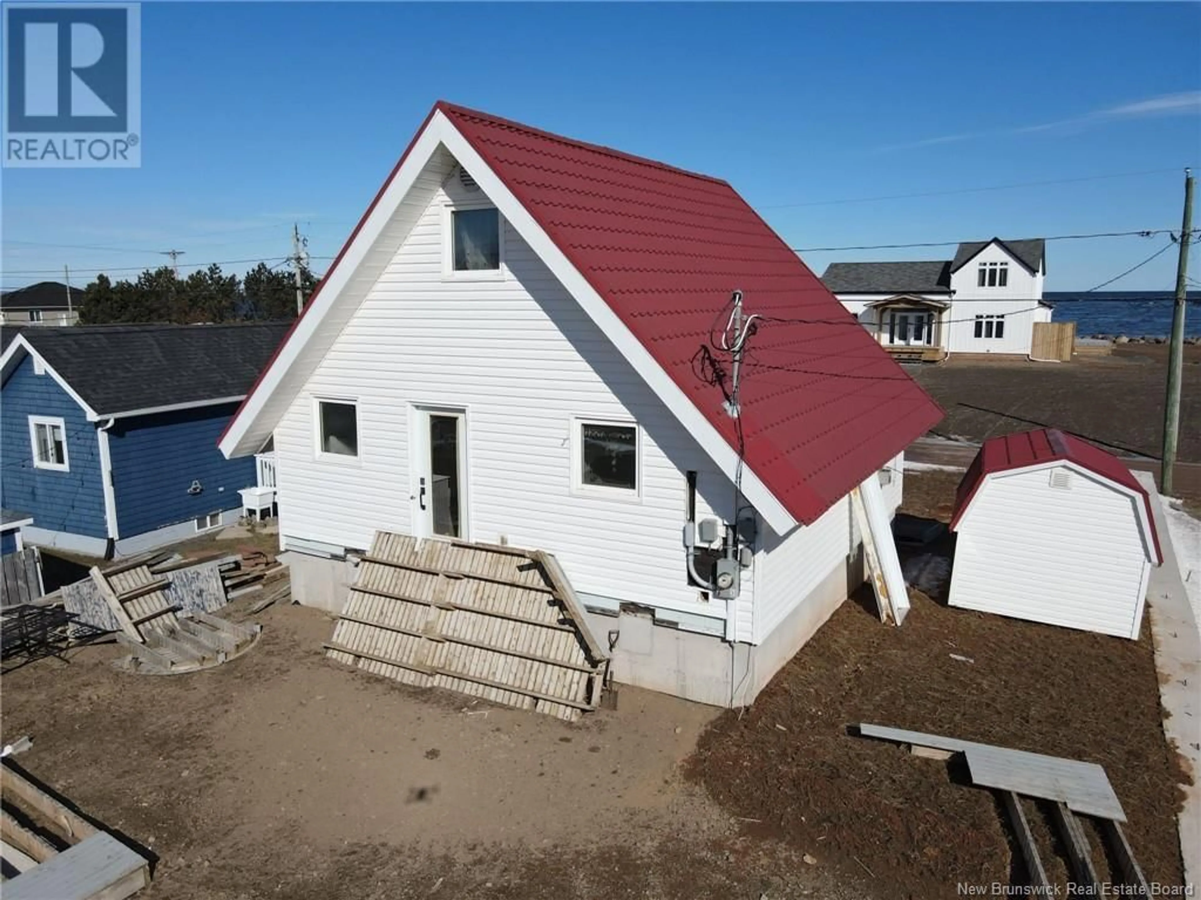 A pic from outside/outdoor area/front of a property/back of a property/a pic from drone, water/lake/river/ocean view for 11 SUR L' OCEAN STREET, Grand-Barachois New Brunswick E4P8N9