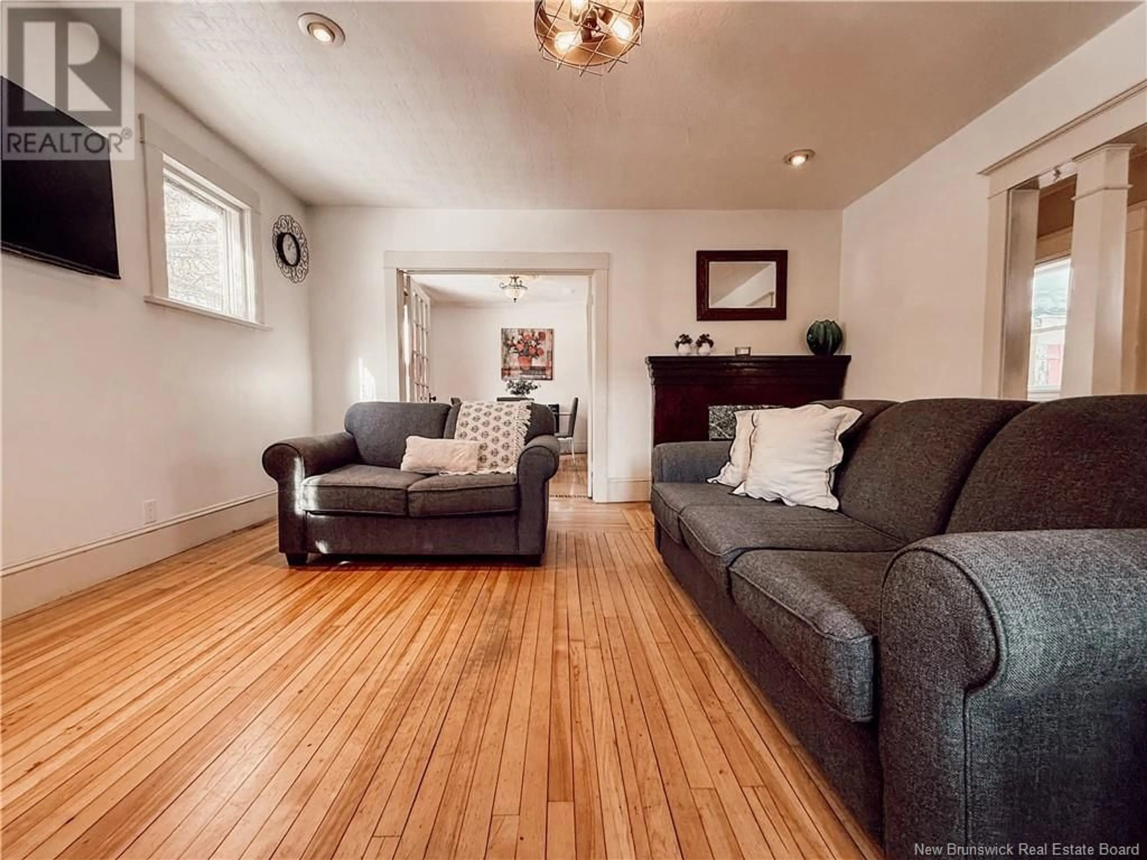 Living room with furniture, wood/laminate floor for 51 Fleet, Moncton New Brunswick E1C1S1