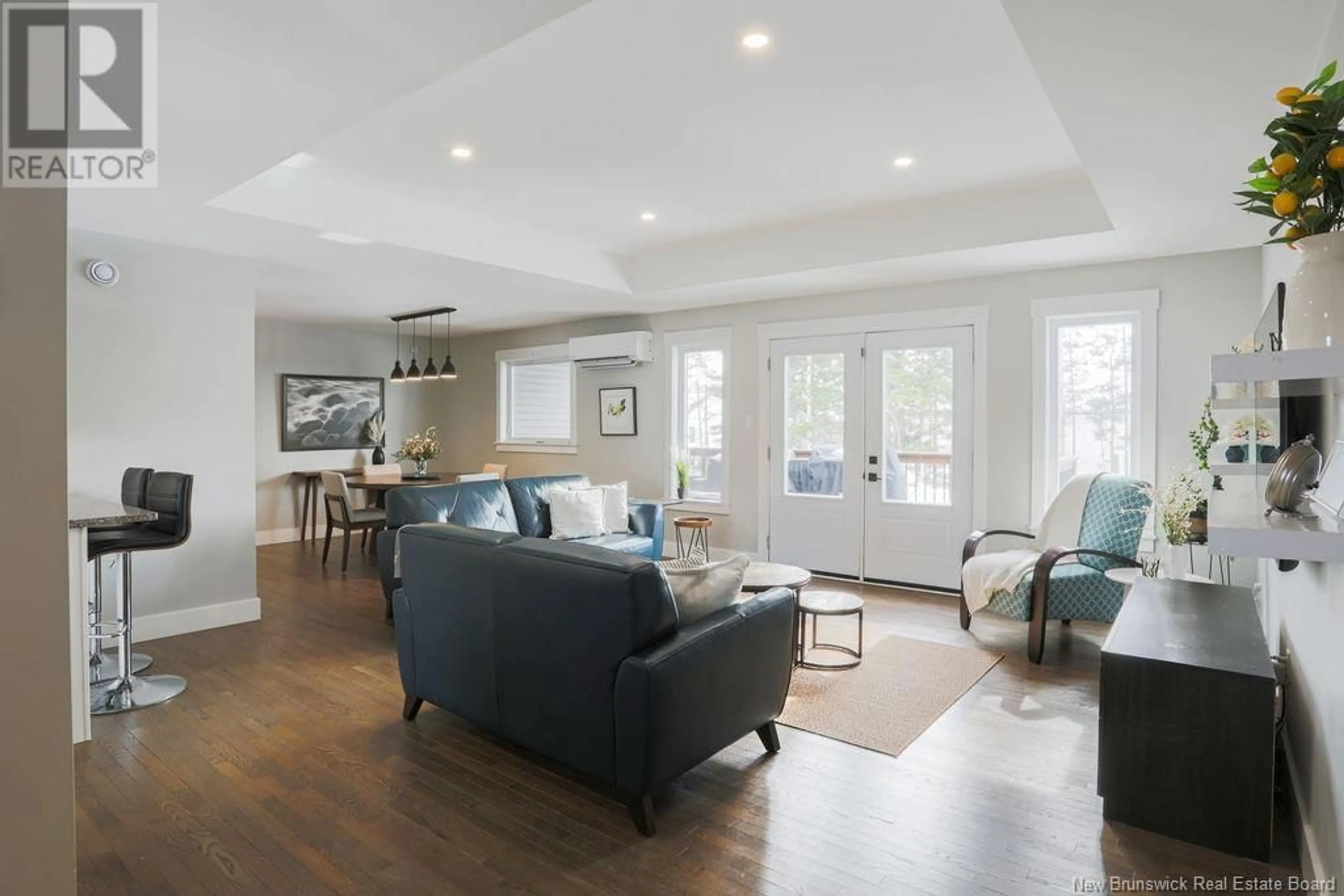 Living room with furniture, wood/laminate floor for 60 Meadowlark Drive, Quispamsis New Brunswick E2E0T6