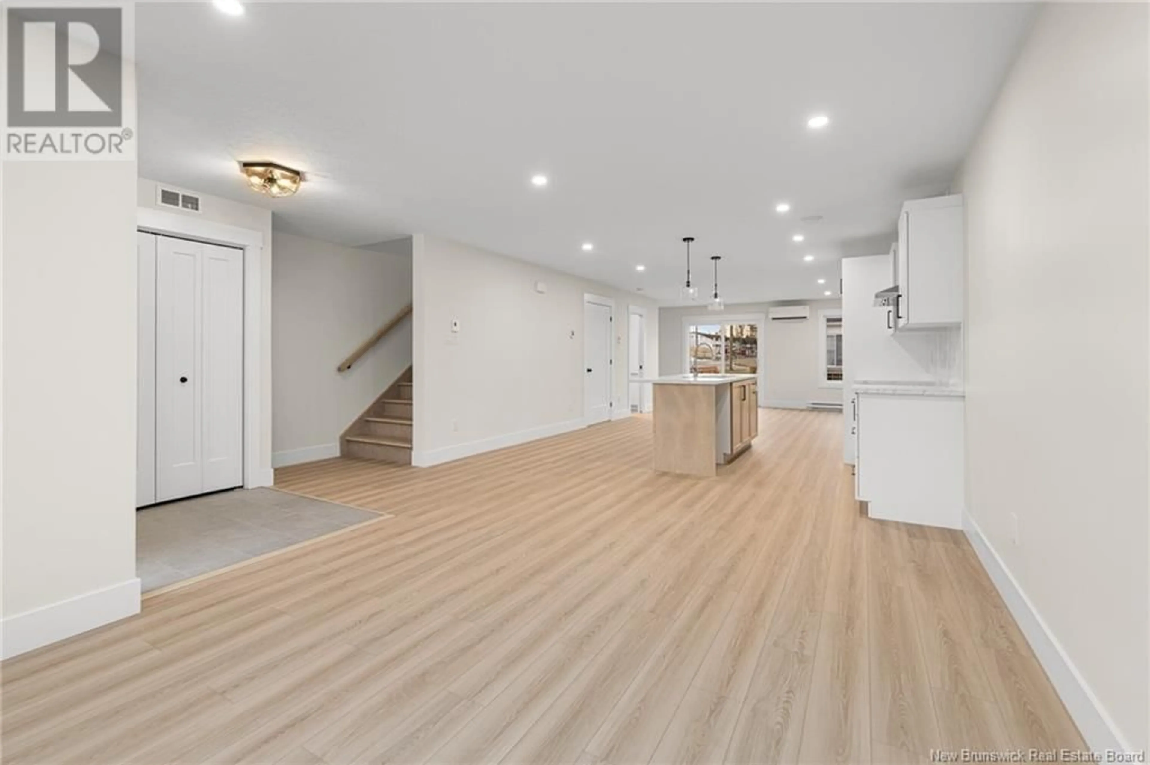 Open concept kitchen, wood/laminate floor for 148 Ernest Street, Dieppe New Brunswick E1A8R4