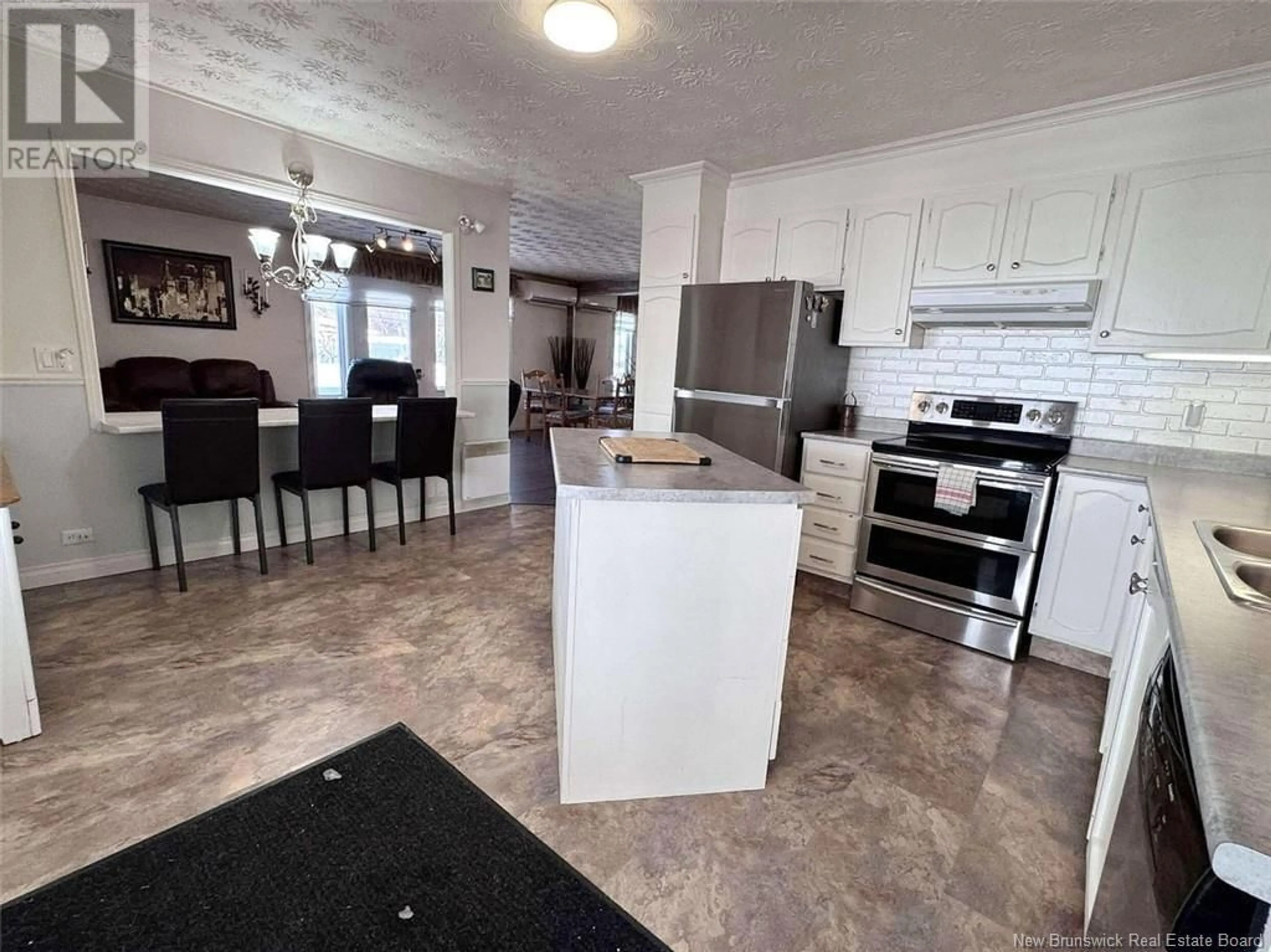 Open concept kitchen, ceramic/tile floor for 67 Grondin Street, Saint-Jacques New Brunswick E7B1J7