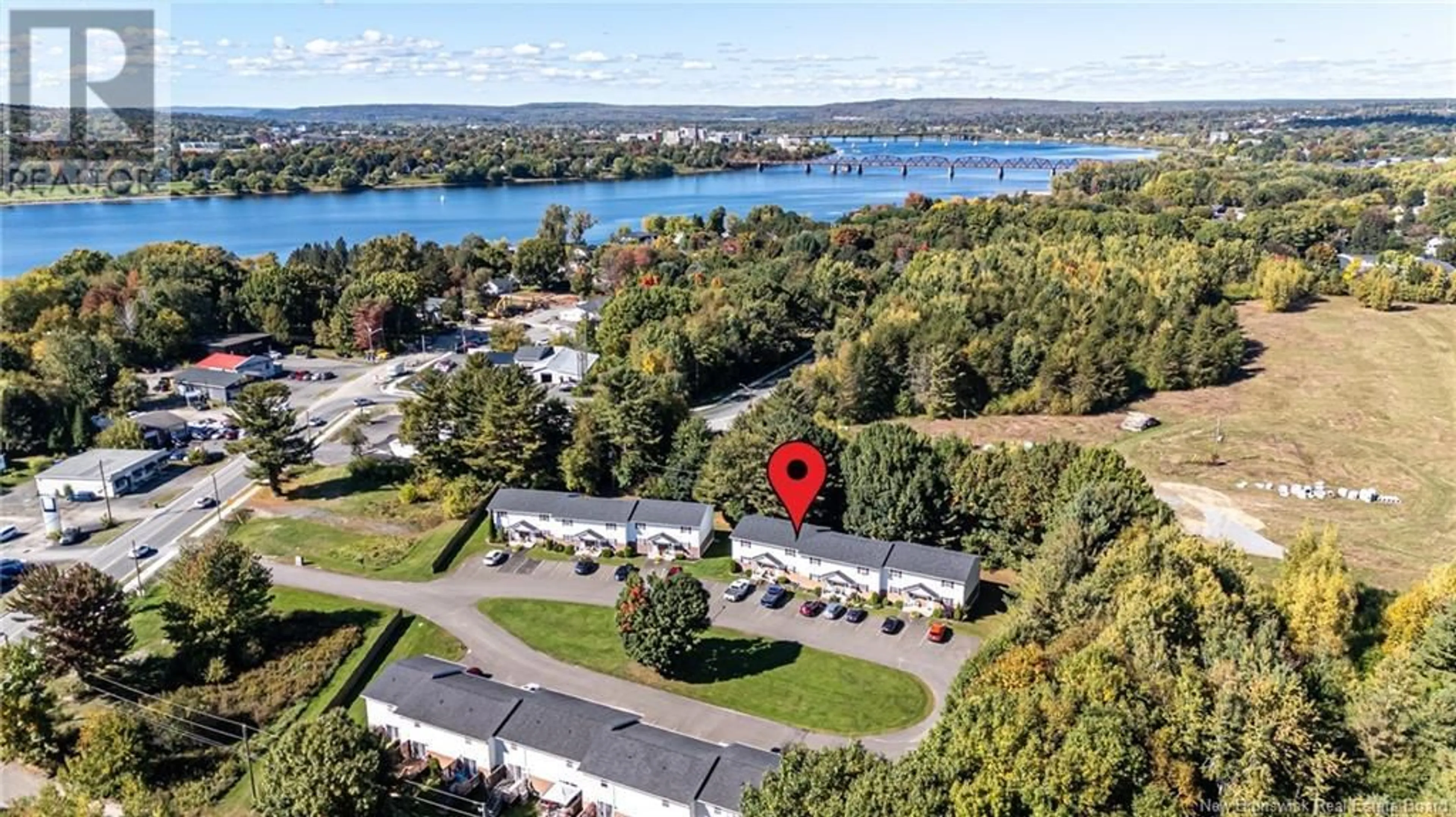 A pic from outside/outdoor area/front of a property/back of a property/a pic from drone, water/lake/river/ocean view for 173 Riverside Drive Unit# 2, Fredericton New Brunswick E3A6R1