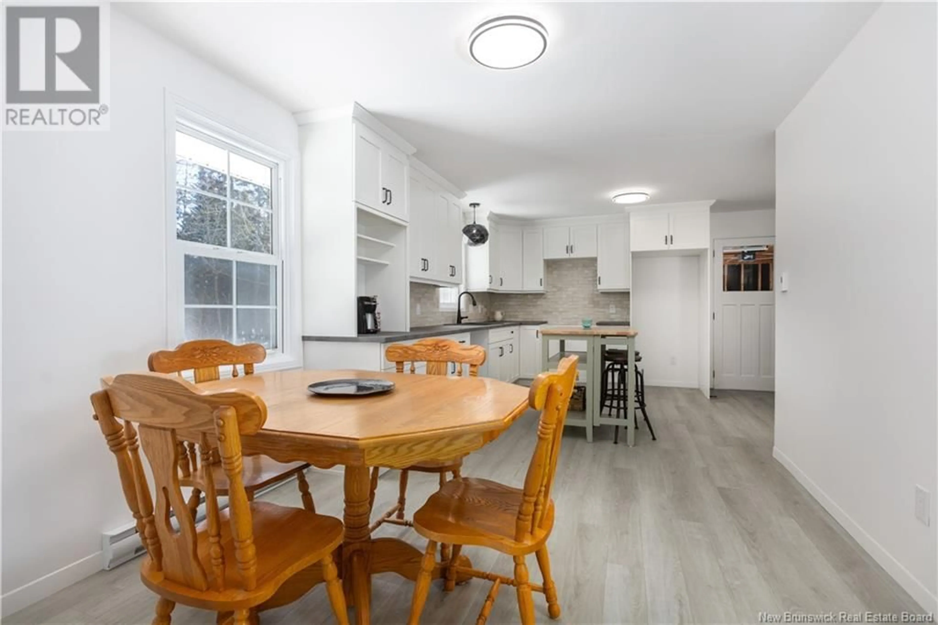 Open concept kitchen, wood/laminate floor for 2262 Route 115, Irishtown New Brunswick E1H2L1