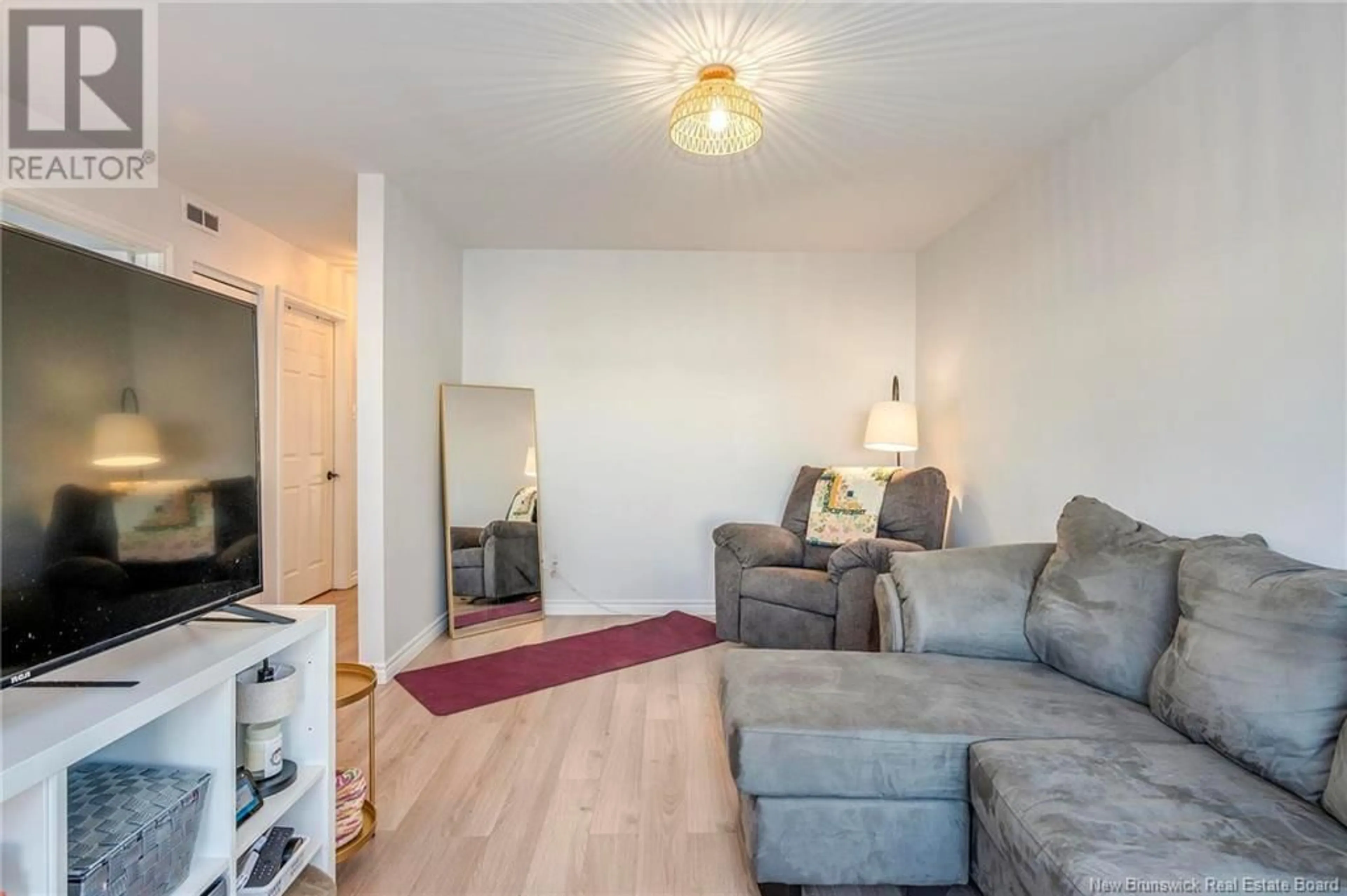 Living room with furniture, wood/laminate floor for 12 - 435 PINE GLEN ROAD, Riverview New Brunswick E1B4J8