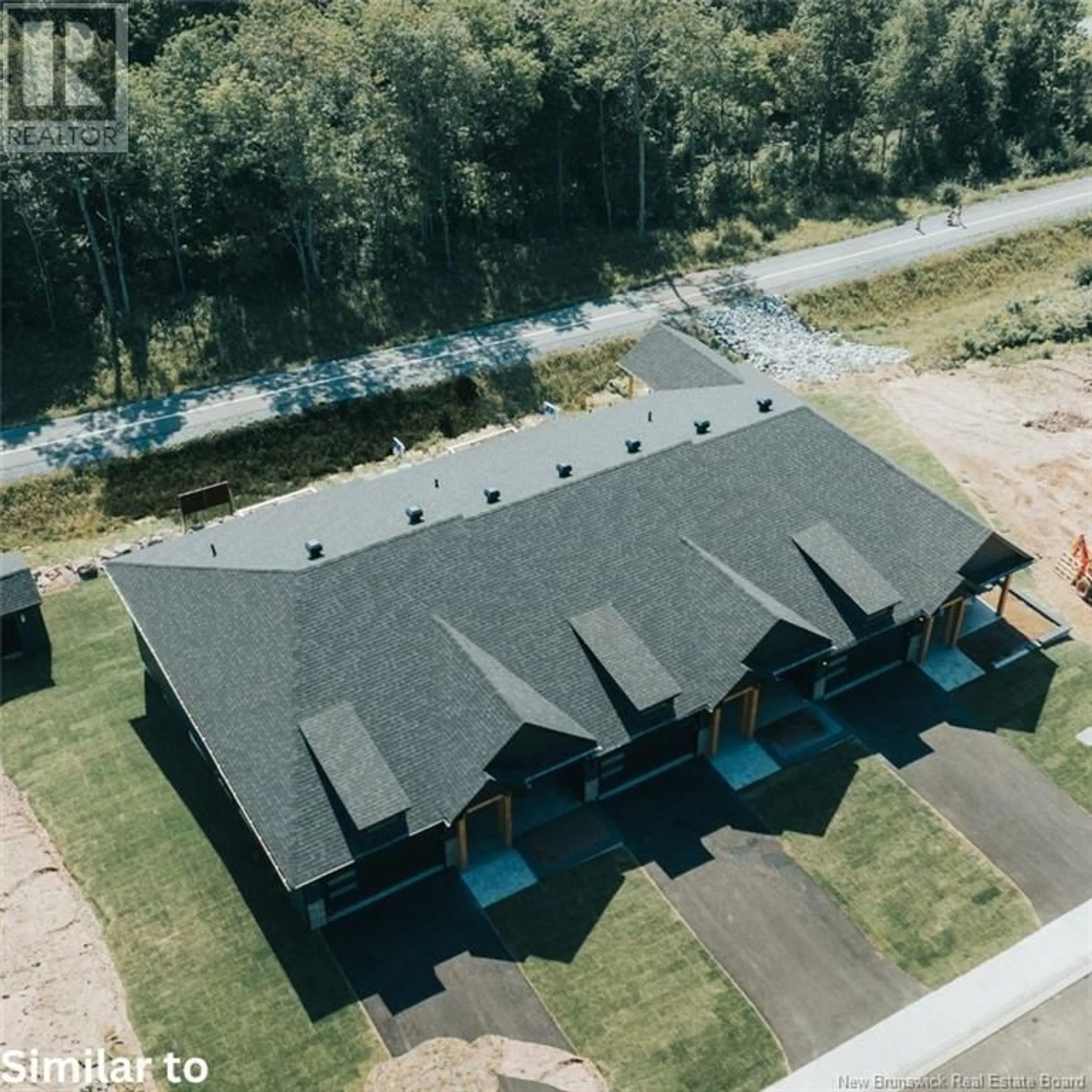 A pic from outside/outdoor area/front of a property/back of a property/a pic from drone, water/lake/river/ocean view for 9 Wetmore Boulevard, Quispamsis New Brunswick E2E2T8