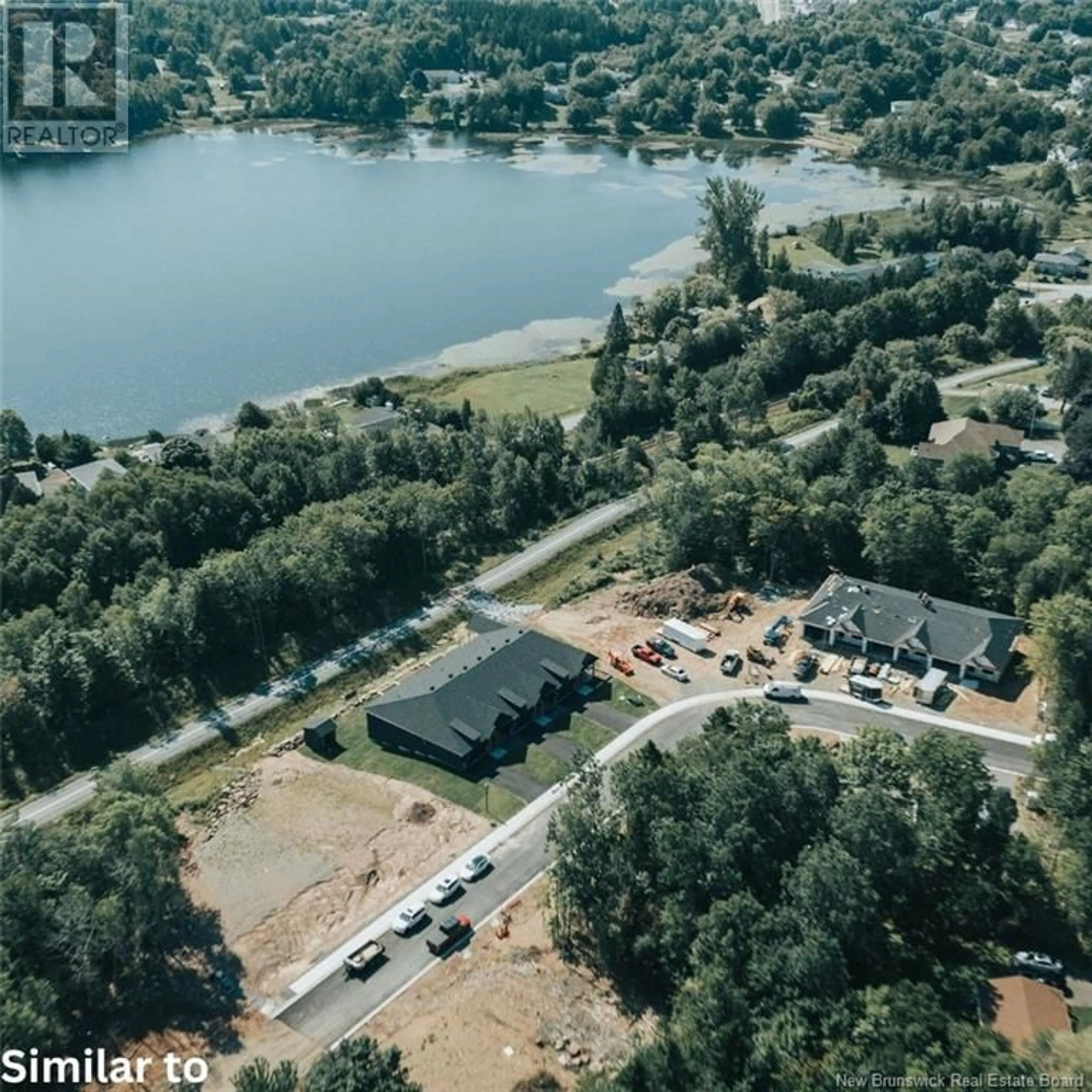 A pic from outside/outdoor area/front of a property/back of a property/a pic from drone, water/lake/river/ocean view for 5 WETMORE BOULEVARD, Quispamsis New Brunswick E2E2T8