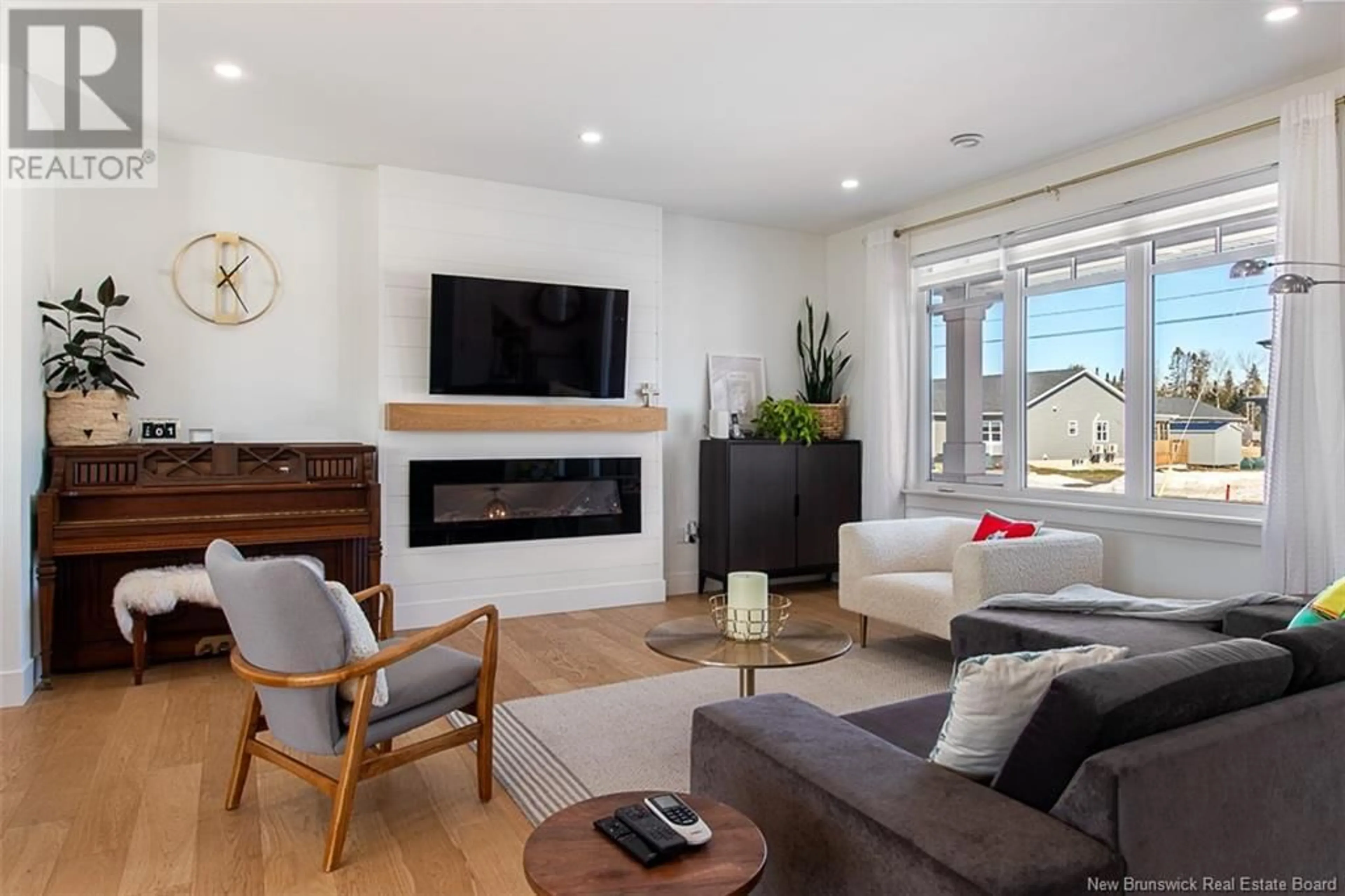 Living room with furniture, wood/laminate floor for 345 GLENGROVE ROAD, Moncton New Brunswick E1A9S7