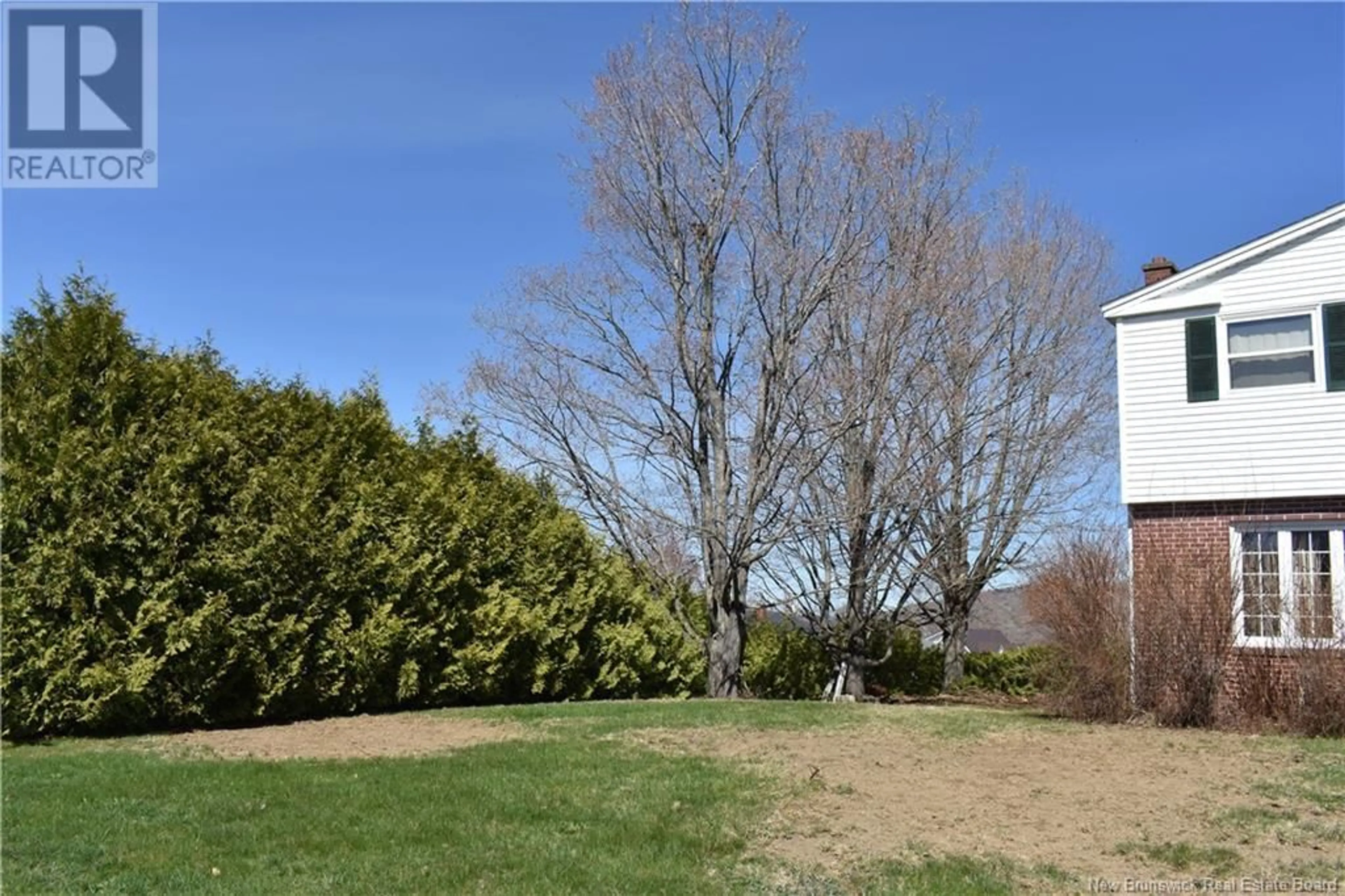 A pic from outside/outdoor area/front of a property/back of a property/a pic from drone, forest/trees view for 118 CREIGHTON STREET, Woodstock New Brunswick E7M1N1