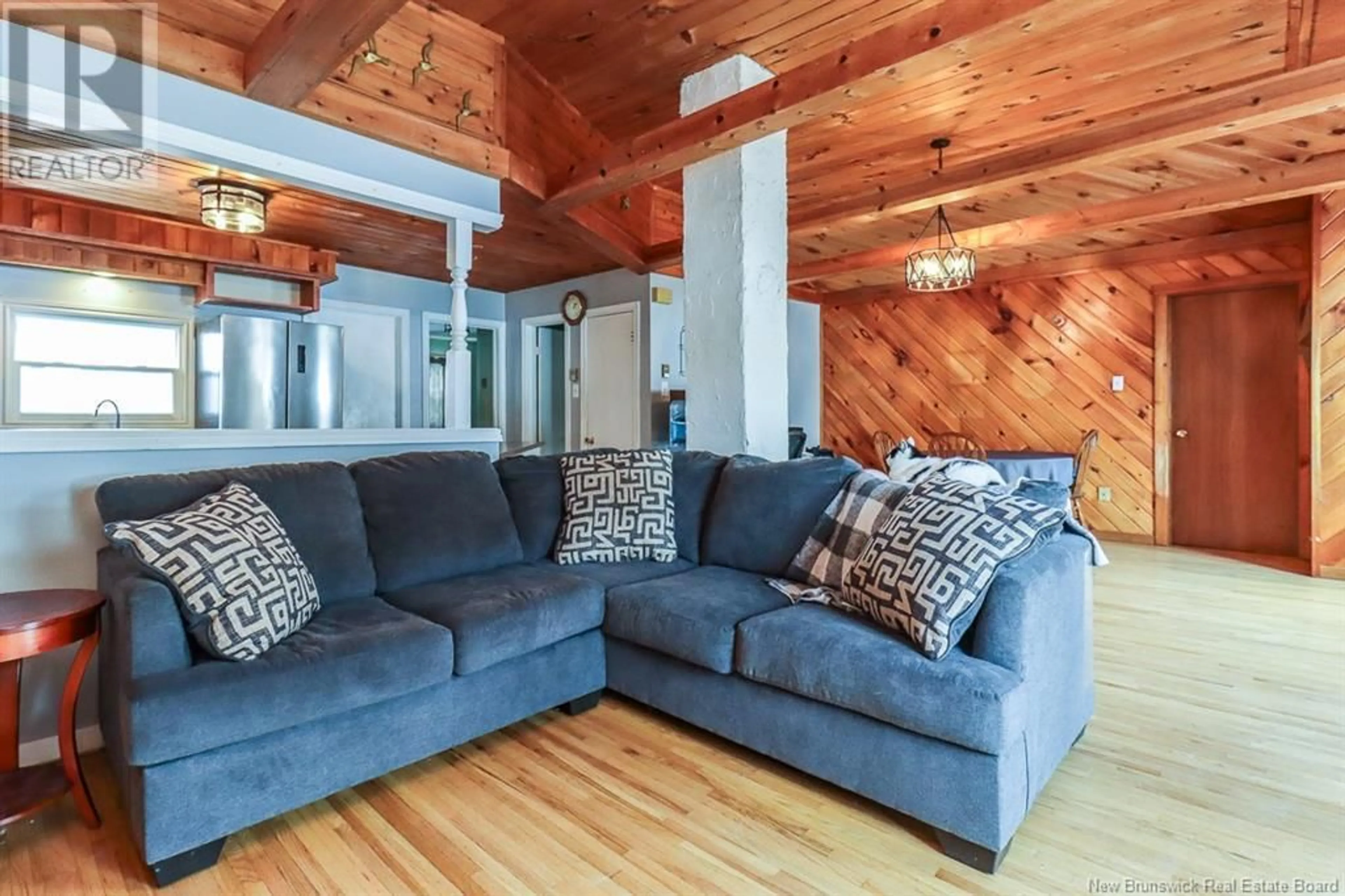 Living room with furniture, wood/laminate floor for 4195 Loch Lomond Road, Saint John New Brunswick E5N1C6