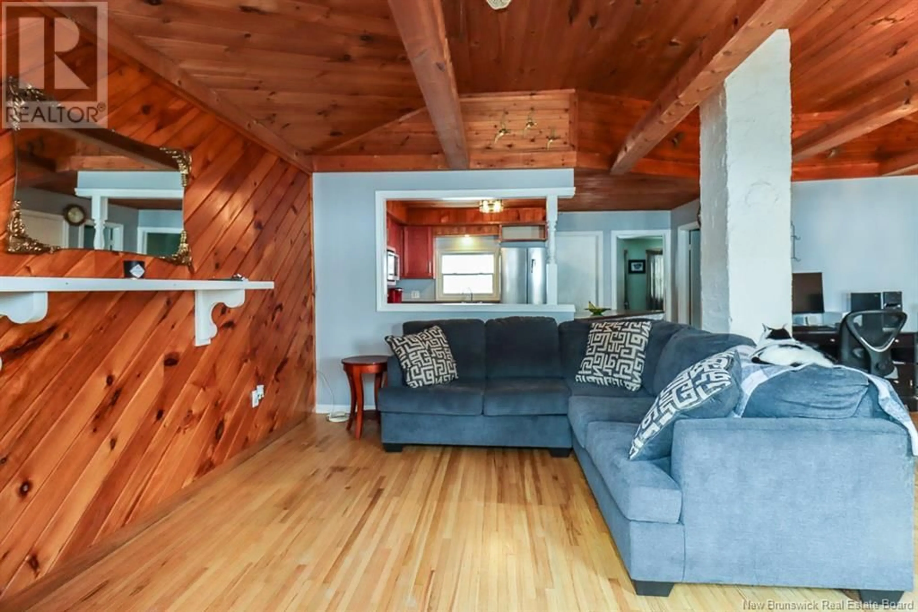 Living room with furniture, wood/laminate floor for 4195 Loch Lomond Road, Saint John New Brunswick E5N1C6