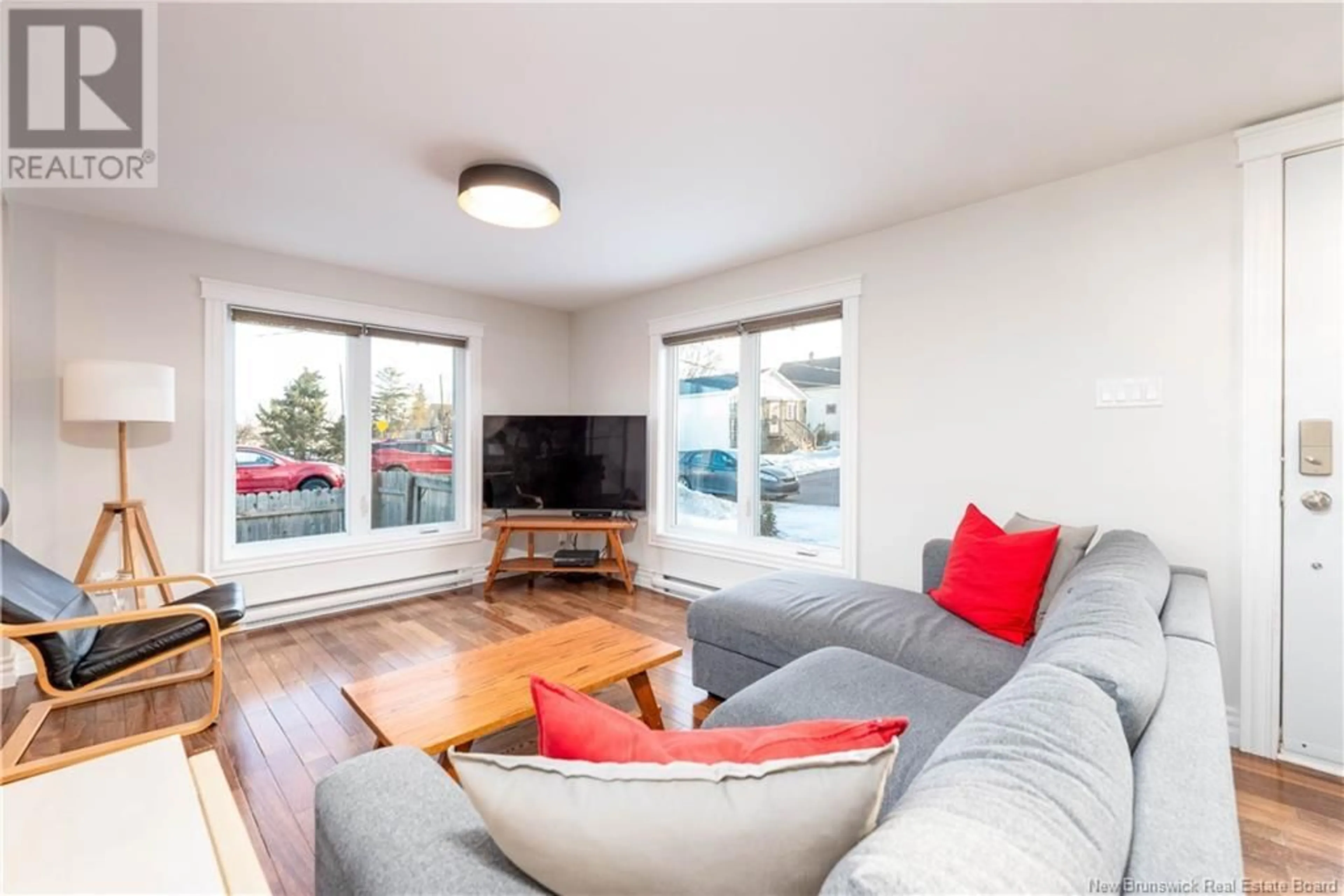 Living room with furniture, wood/laminate floor for 92 Bathurst, Moncton New Brunswick E1A2Z1