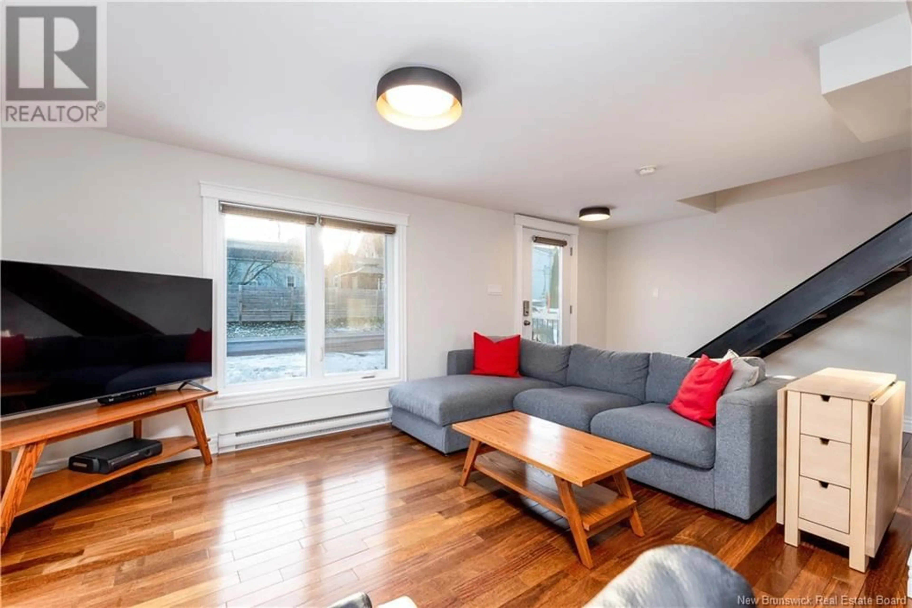 Living room with furniture, wood/laminate floor for 92 Bathurst, Moncton New Brunswick E1A2Z1