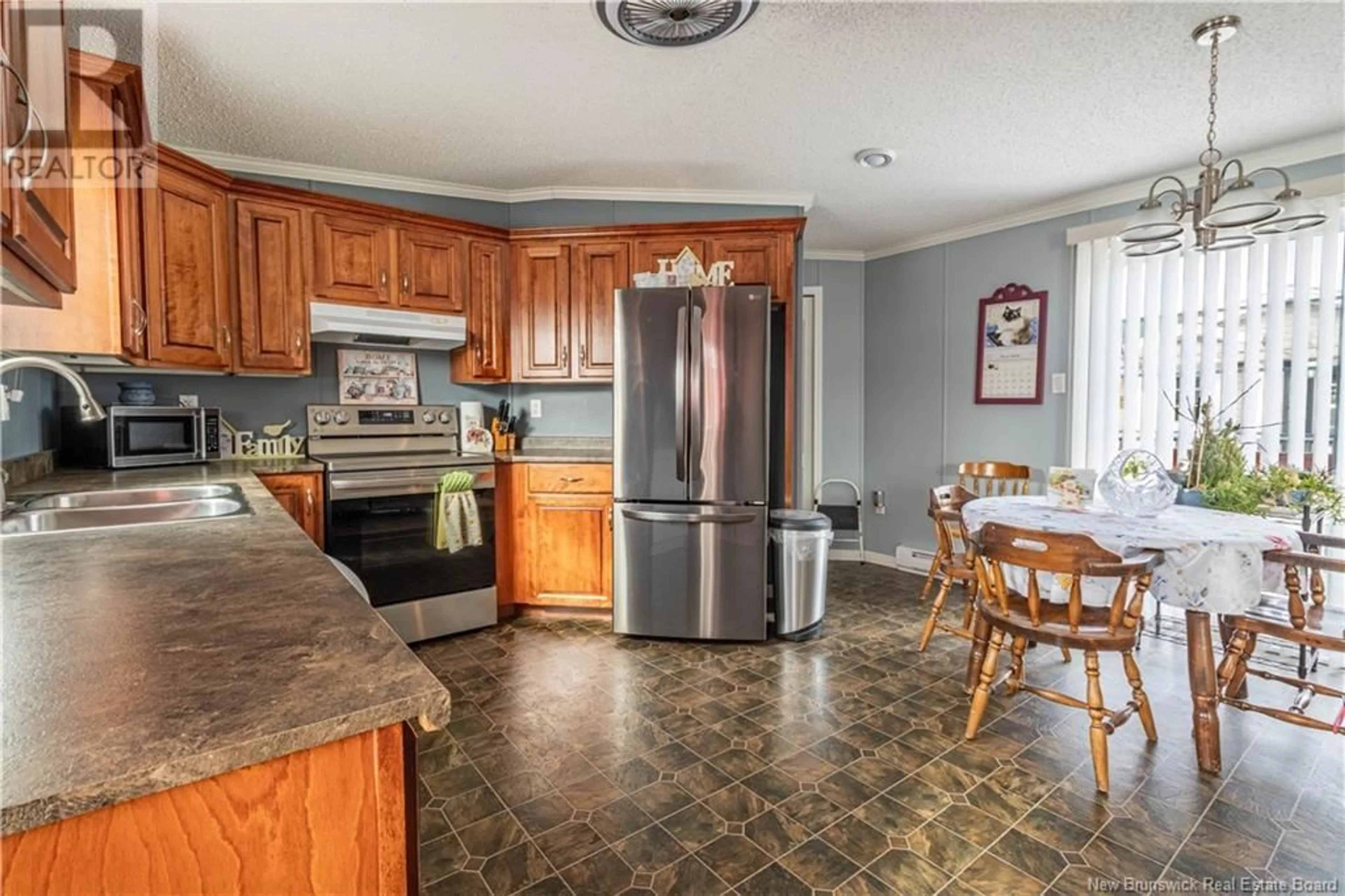 Open concept kitchen, ceramic/tile floor for 10 Park Avenue, Sussex Corner New Brunswick E4E0B3