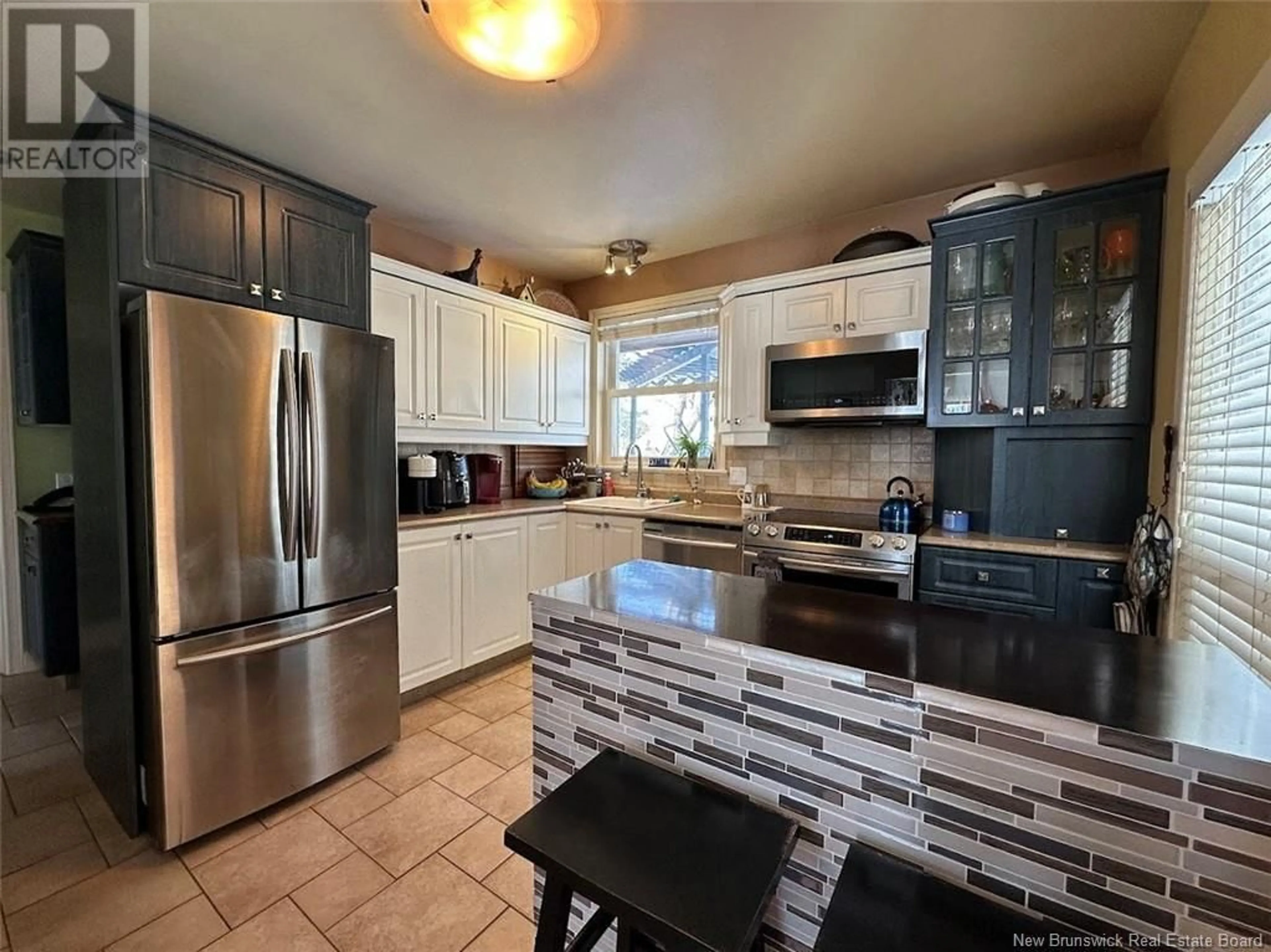 Open concept kitchen, ceramic/tile floor for 17 BERNIER STREET, Edmundston New Brunswick E3V1Y6