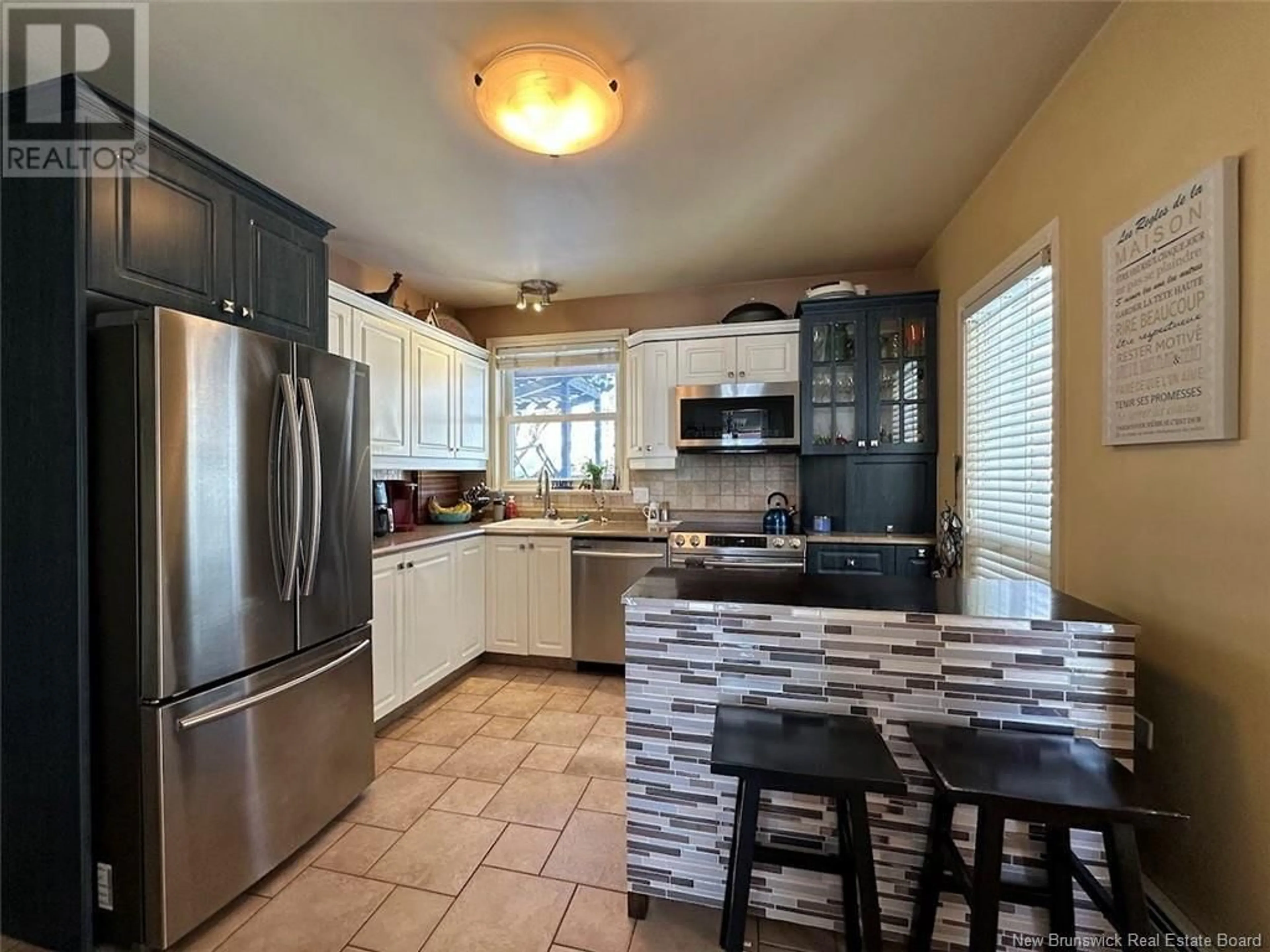 Open concept kitchen, ceramic/tile floor for 17 BERNIER STREET, Edmundston New Brunswick E3V1Y6