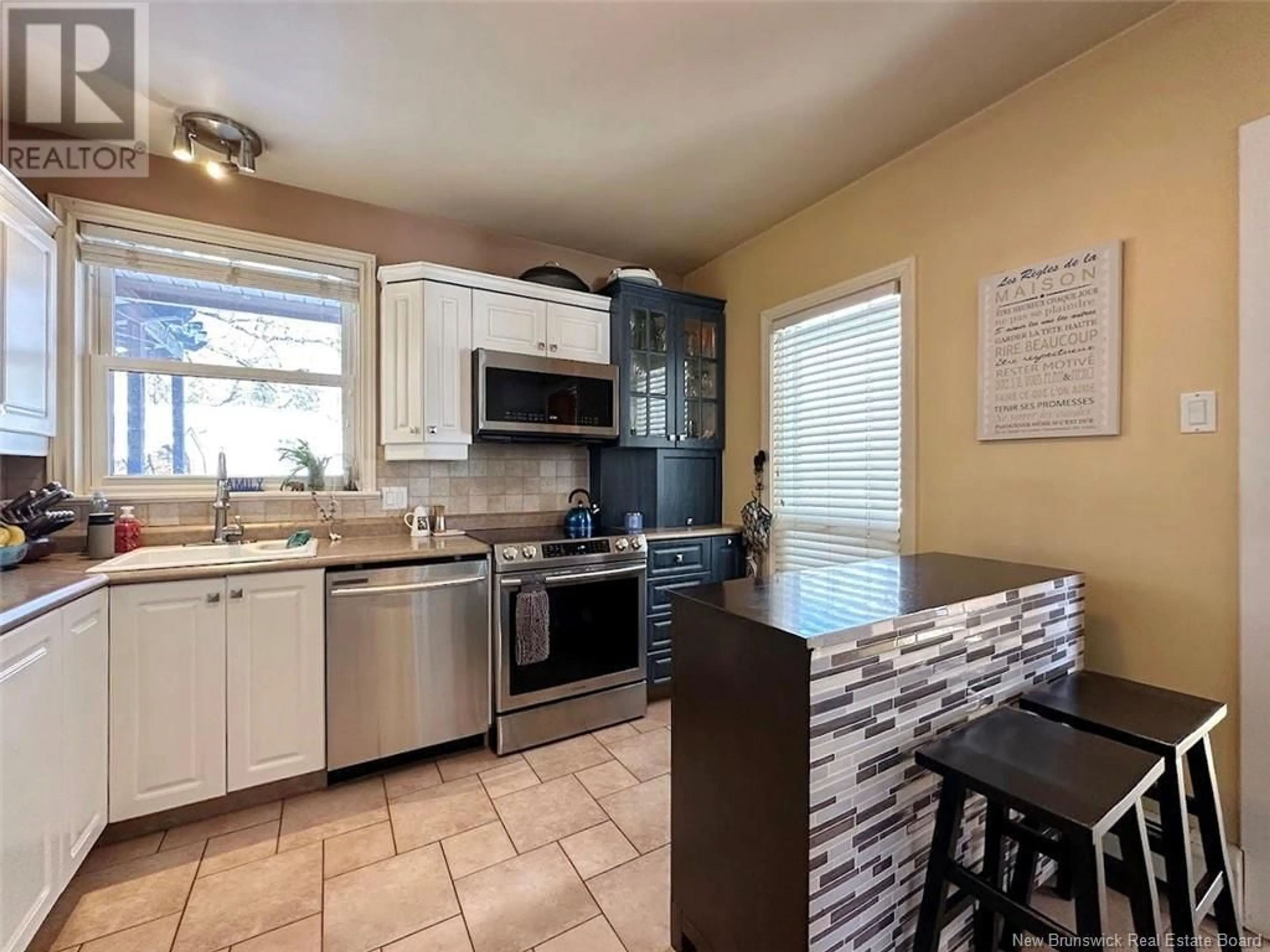 Open concept kitchen, ceramic/tile floor for 17 BERNIER STREET, Edmundston New Brunswick E3V1Y6