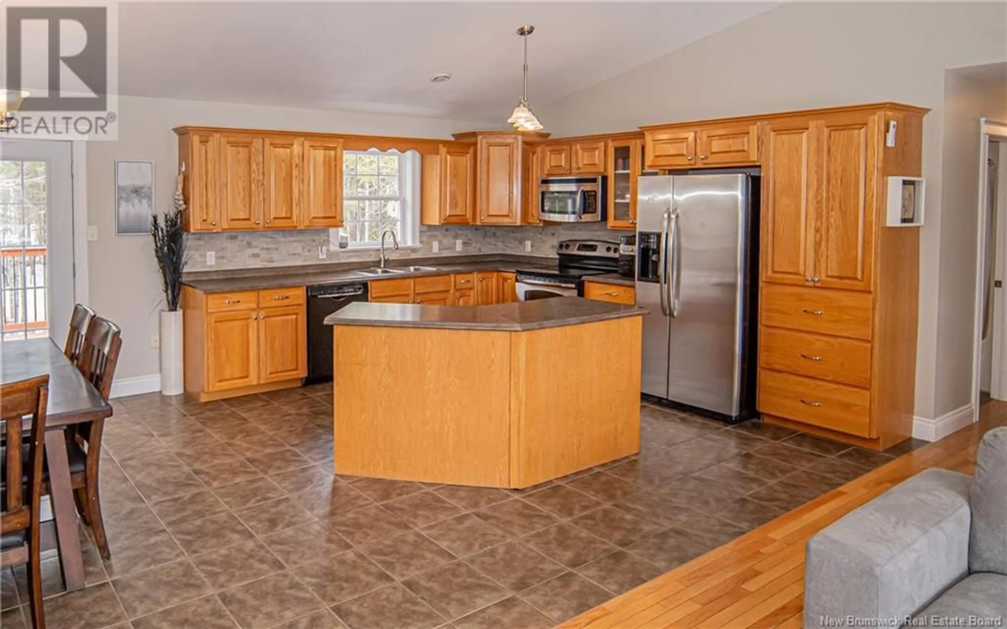 Open concept kitchen, ceramic/tile floor for 118 Woodrush Lane, Waasis New Brunswick E3B0L2