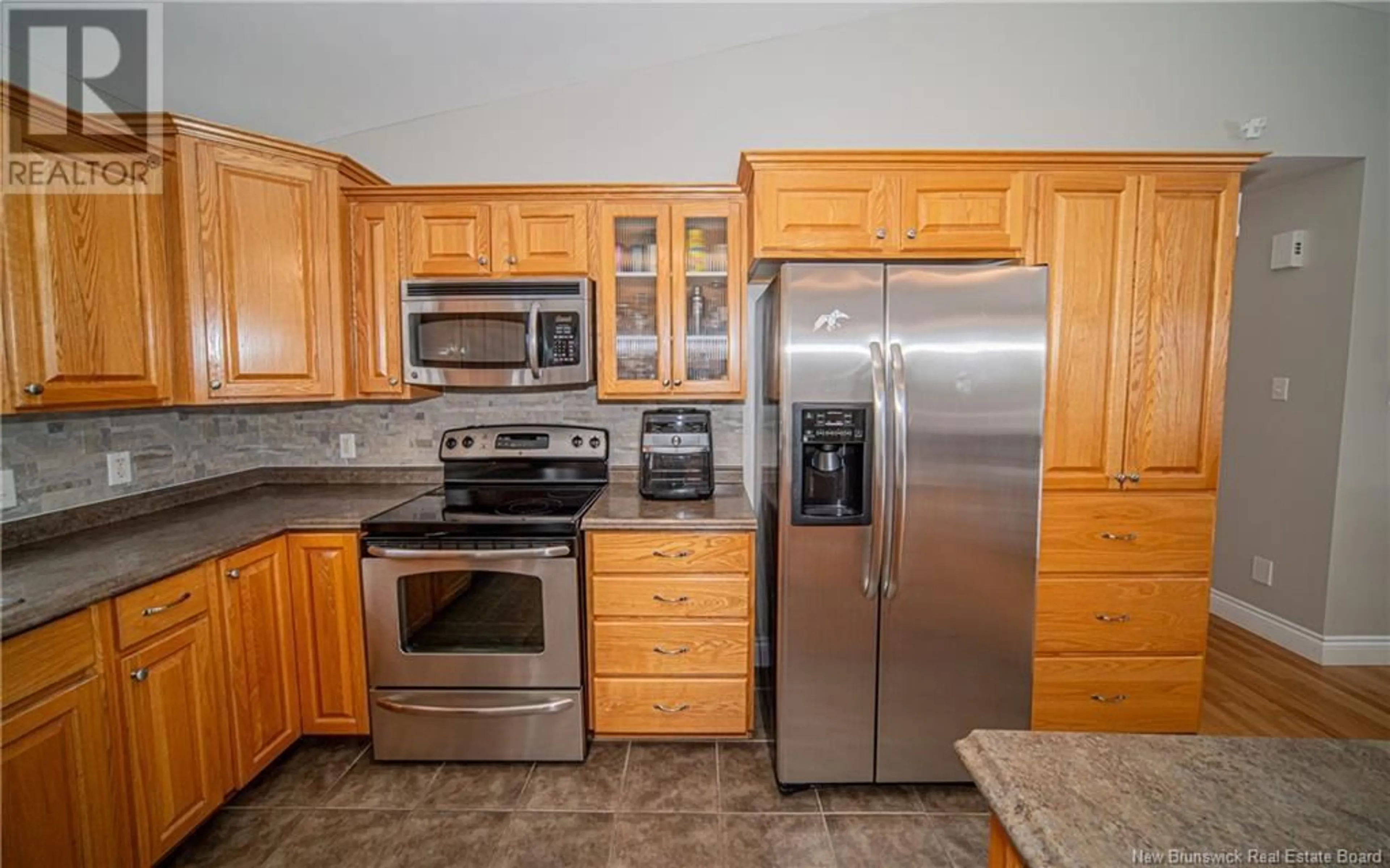 Standard kitchen, ceramic/tile floor for 118 Woodrush Lane, Waasis New Brunswick E3B0L2