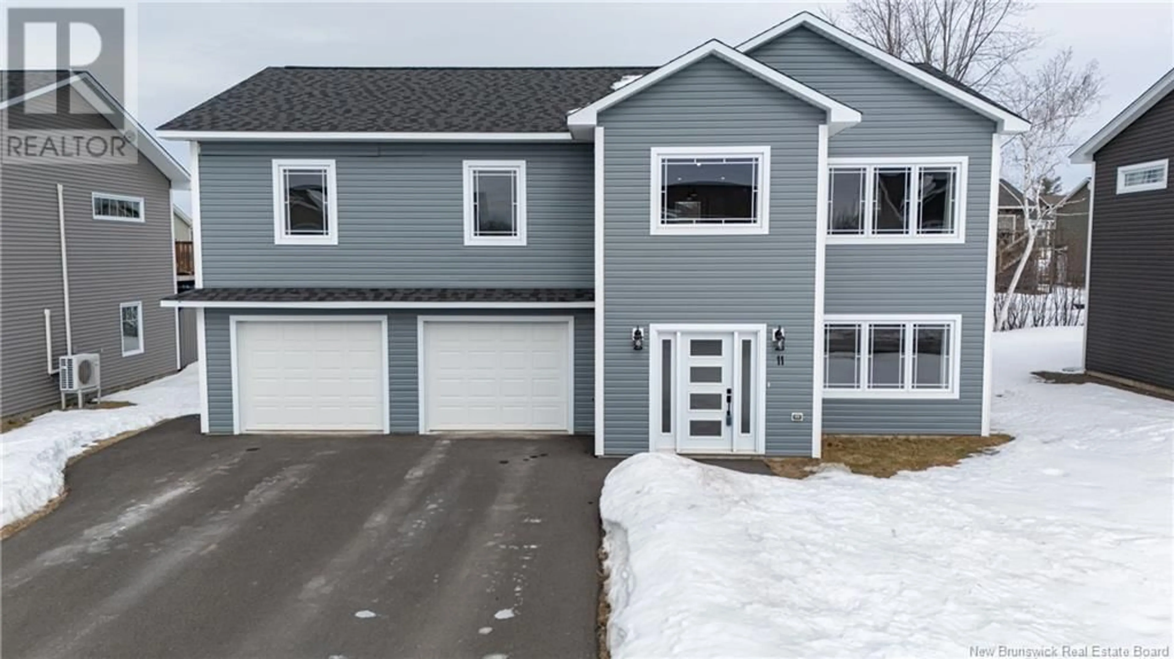 Home with vinyl exterior material, street for 11 Doherty Drive, Oromocto New Brunswick E2V0M7