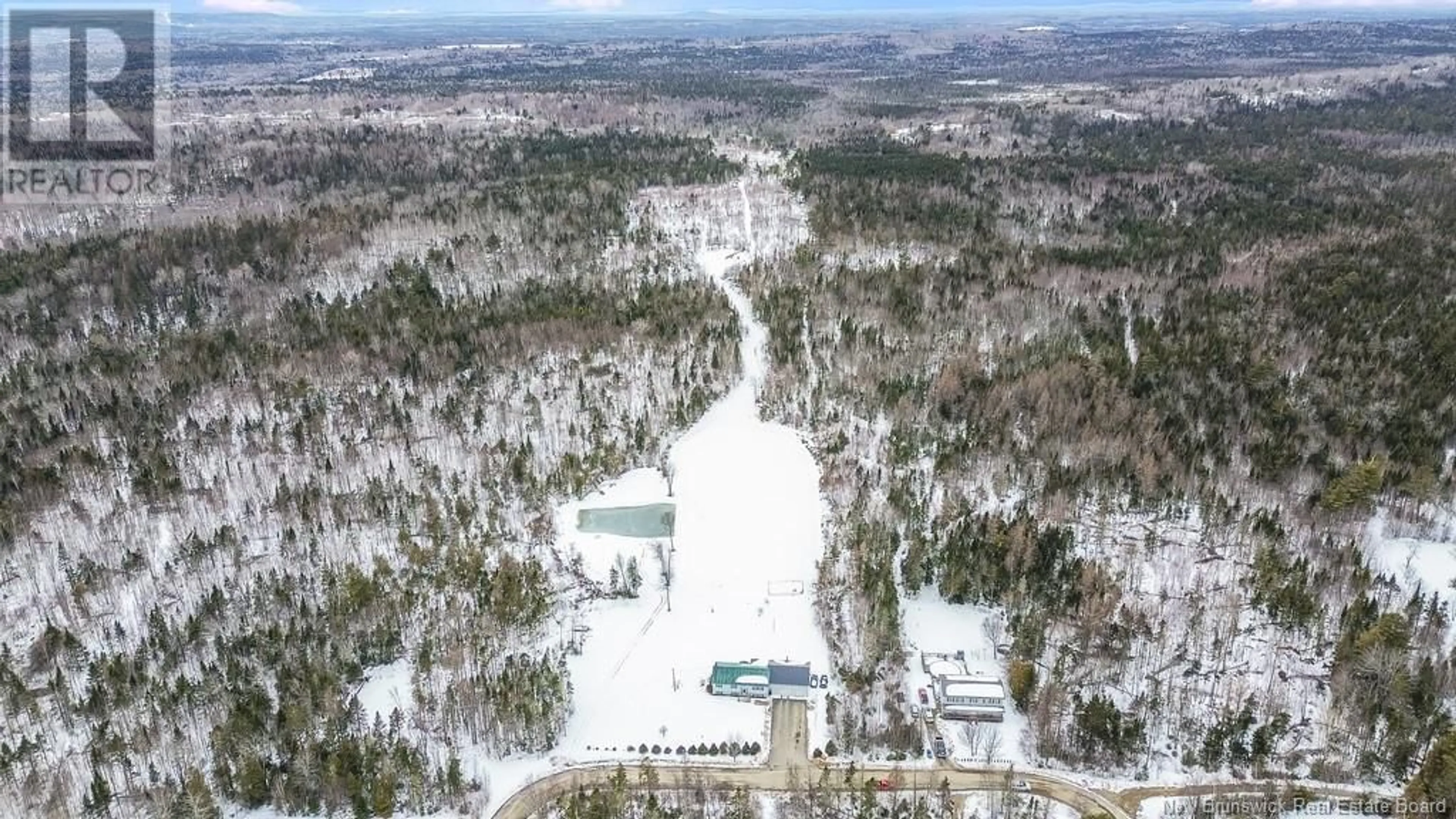 A pic from outside/outdoor area/front of a property/back of a property/a pic from drone, forest/trees view for 8 Nicholas Drive, Old Ridge New Brunswick E3L4Y6