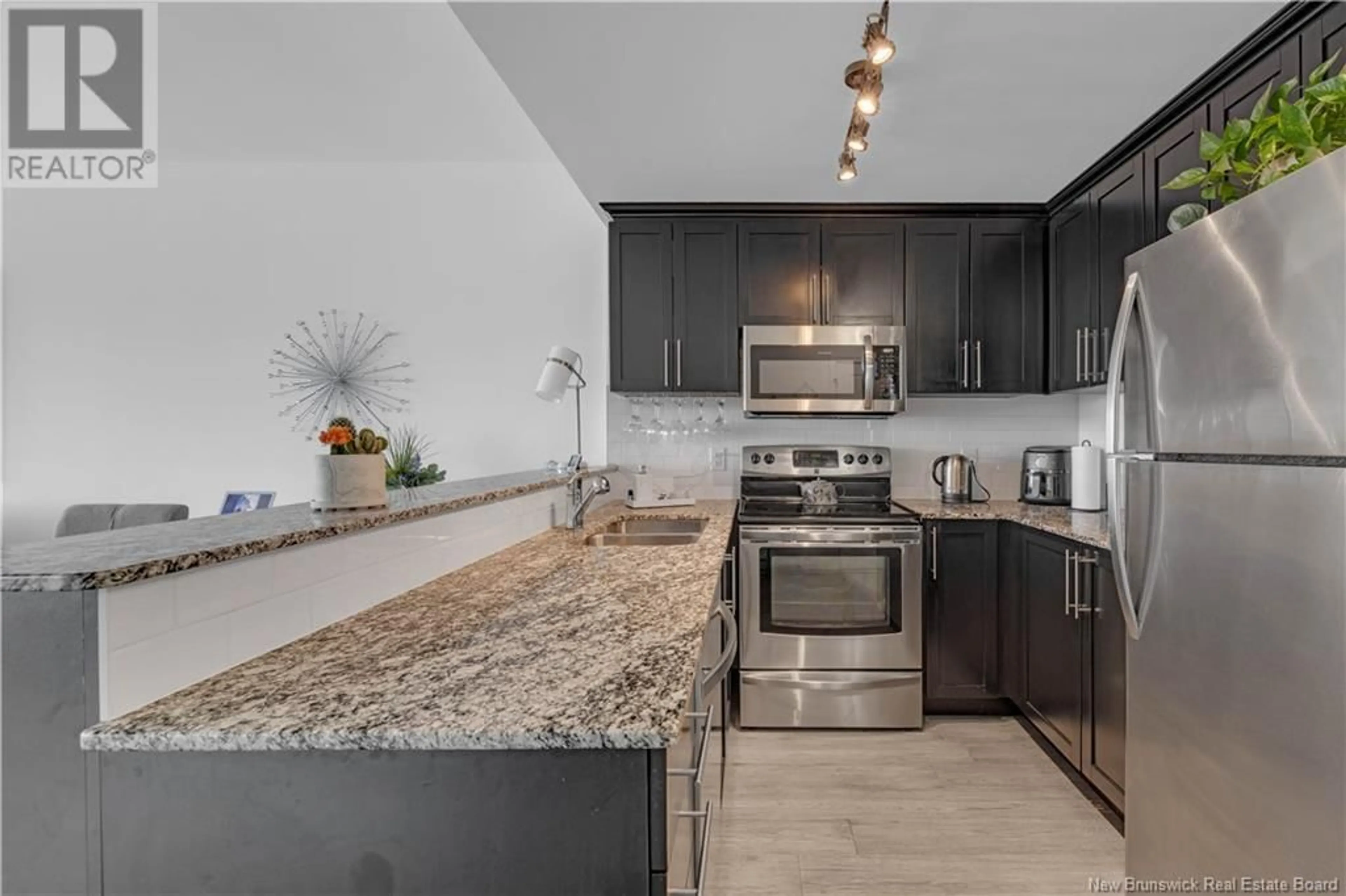 Open concept kitchen, ceramic/tile floor for 243 Prince William Street Unit# 303, Saint John New Brunswick E2L0C6