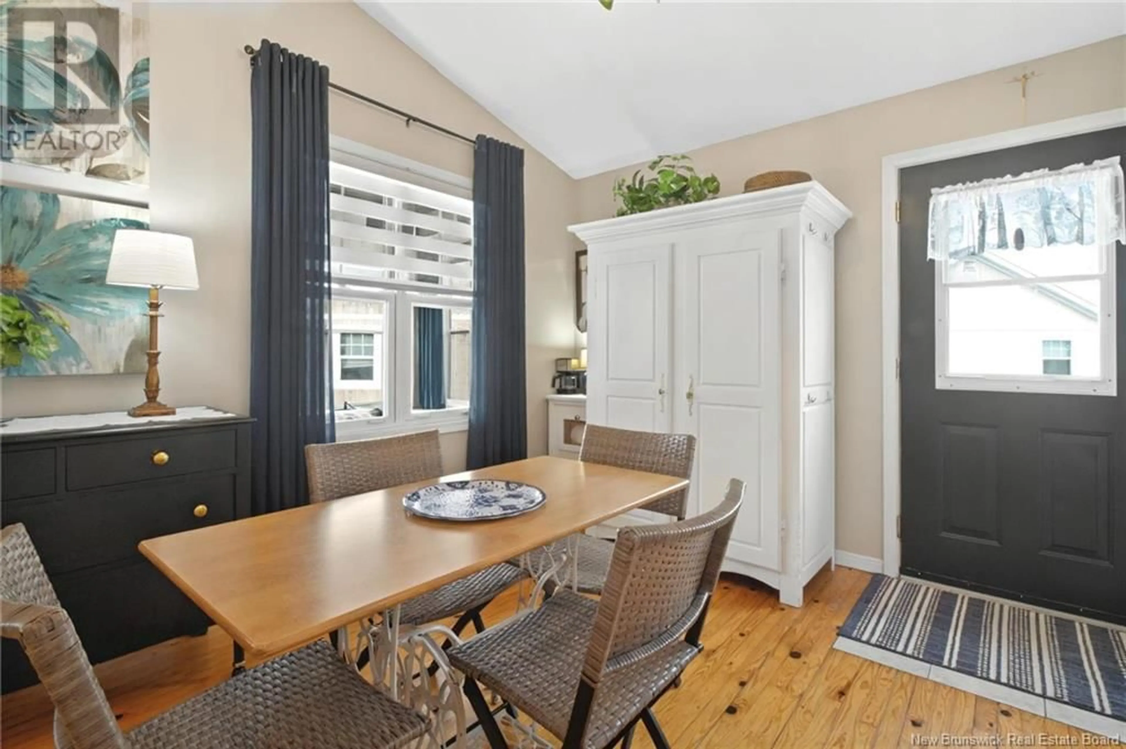 Dining room, wood/laminate floor for 19 - 23 ACADIE, Bouctouche New Brunswick E4S0G3
