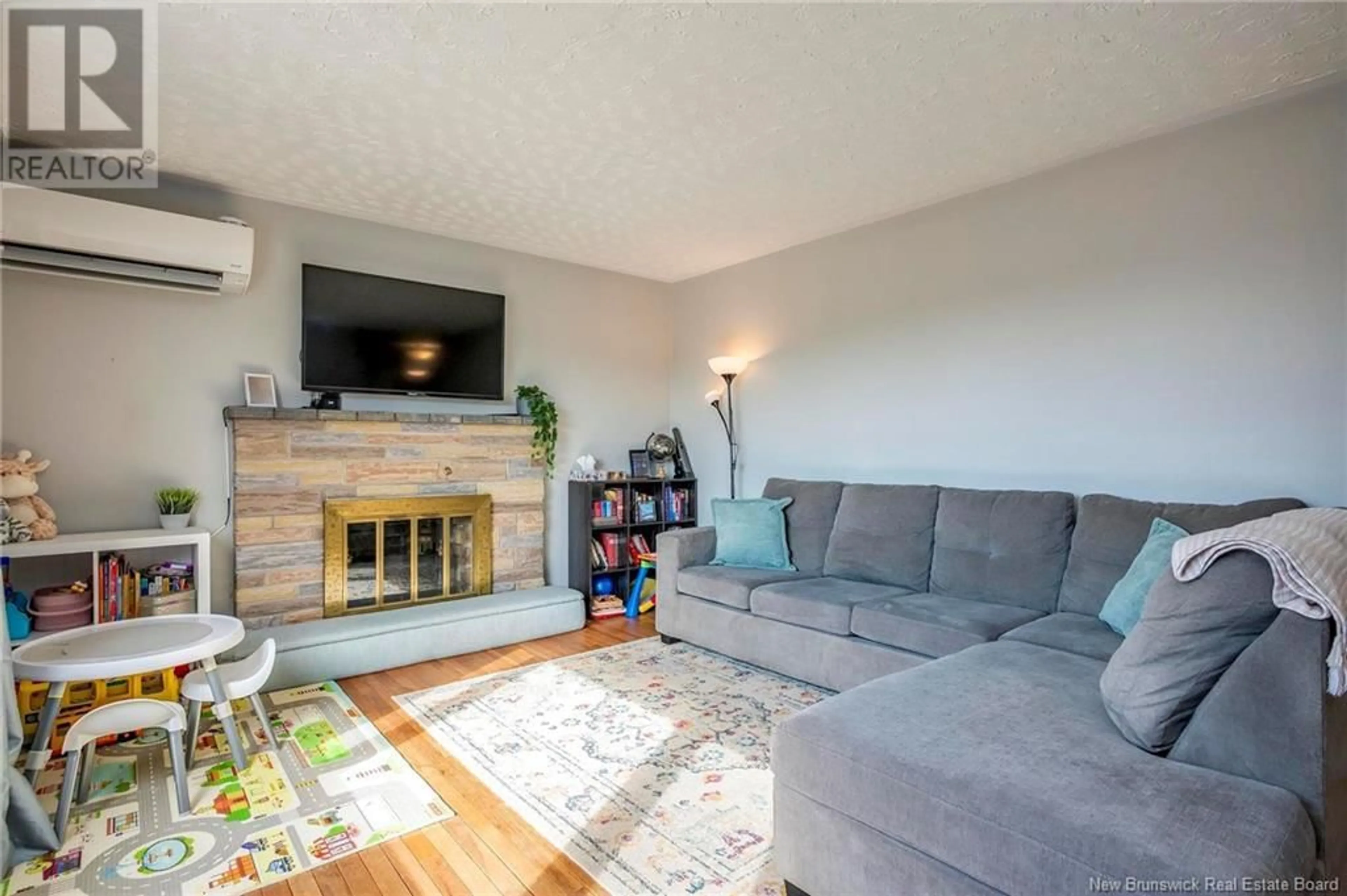 Living room with furniture, wood/laminate floor for 1861 Red Head Road, Saint John New Brunswick E2P1J5