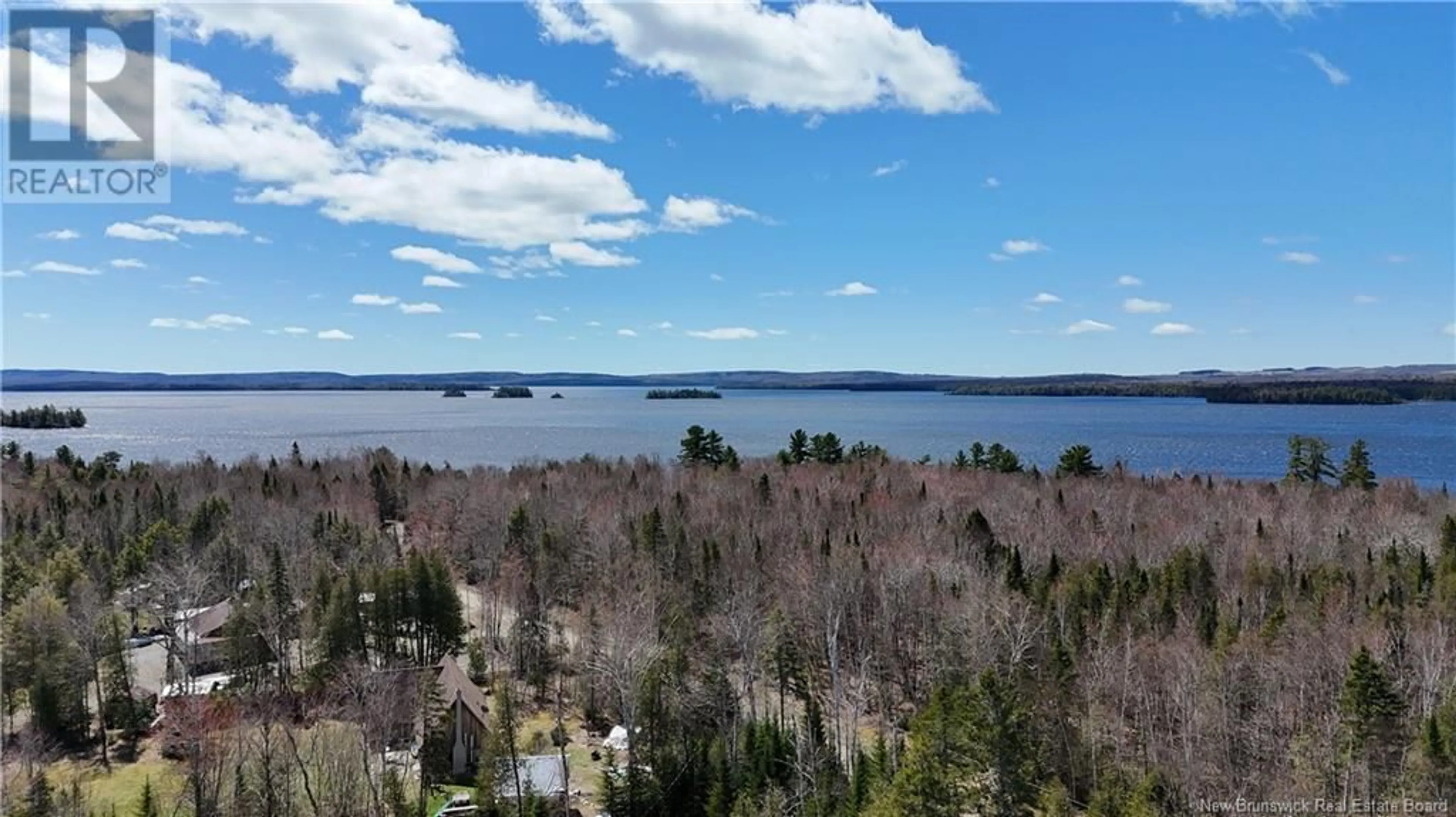 A pic from outside/outdoor area/front of a property/back of a property/a pic from drone, water/lake/river/ocean view for 9 STEVENSON LANE, East Grand Lake New Brunswick E6H1Y6