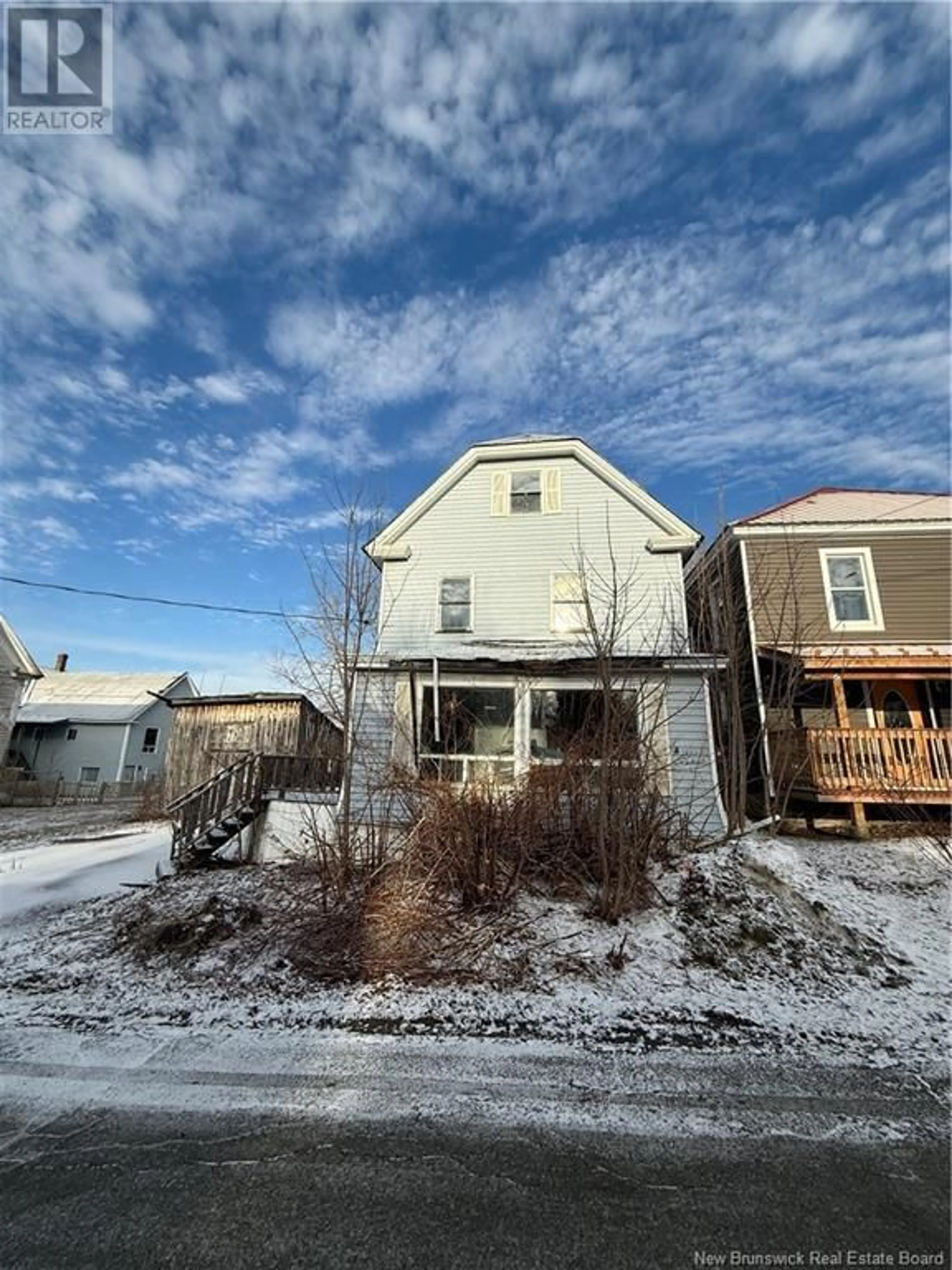 A pic from outside/outdoor area/front of a property/back of a property/a pic from drone, street for 103 Cedar Street, Woodstock New Brunswick E7M1E5