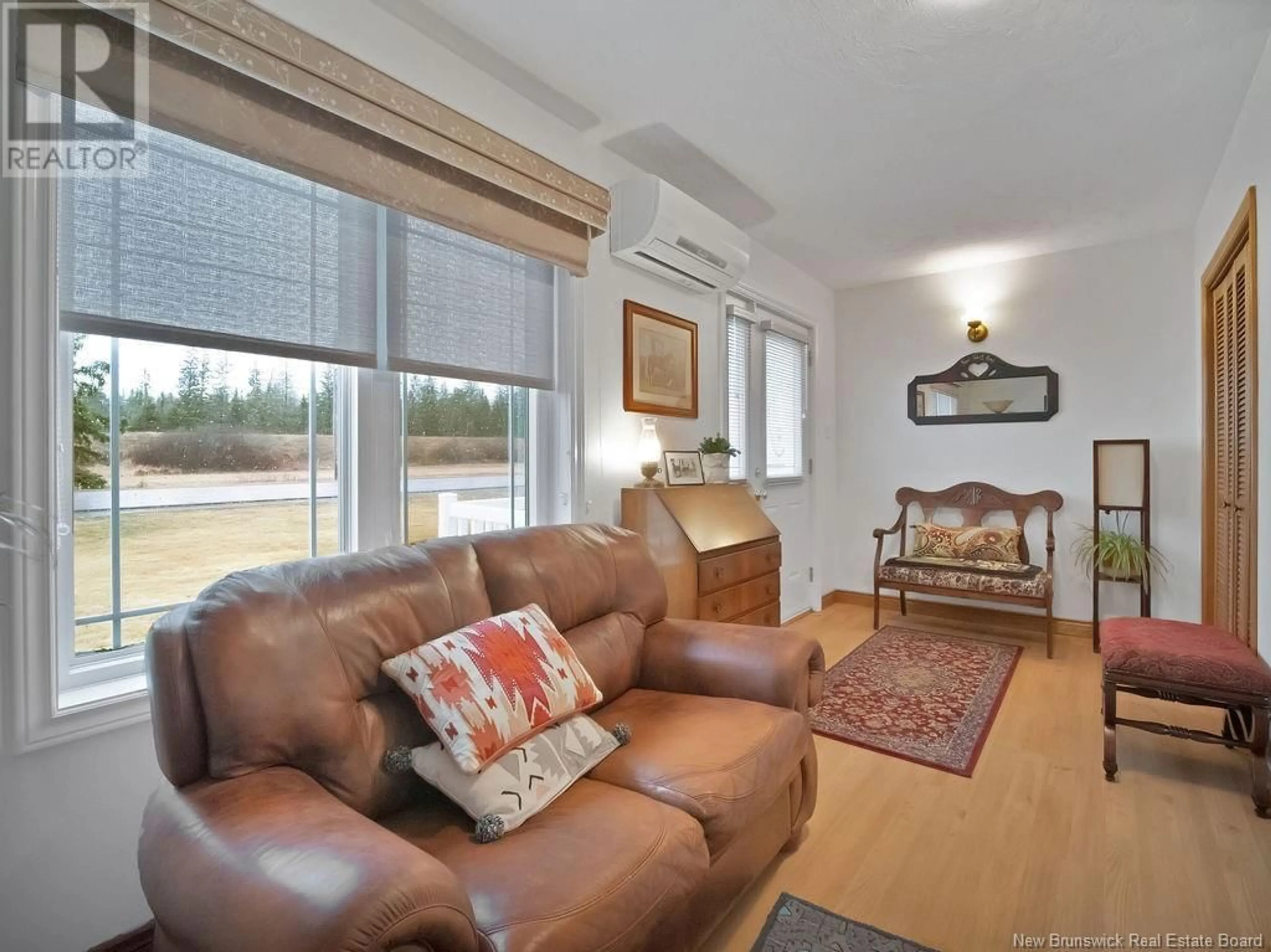 Living room with furniture, wood/laminate floor for 2184 ROUTE 106, Allison New Brunswick E1G4L2