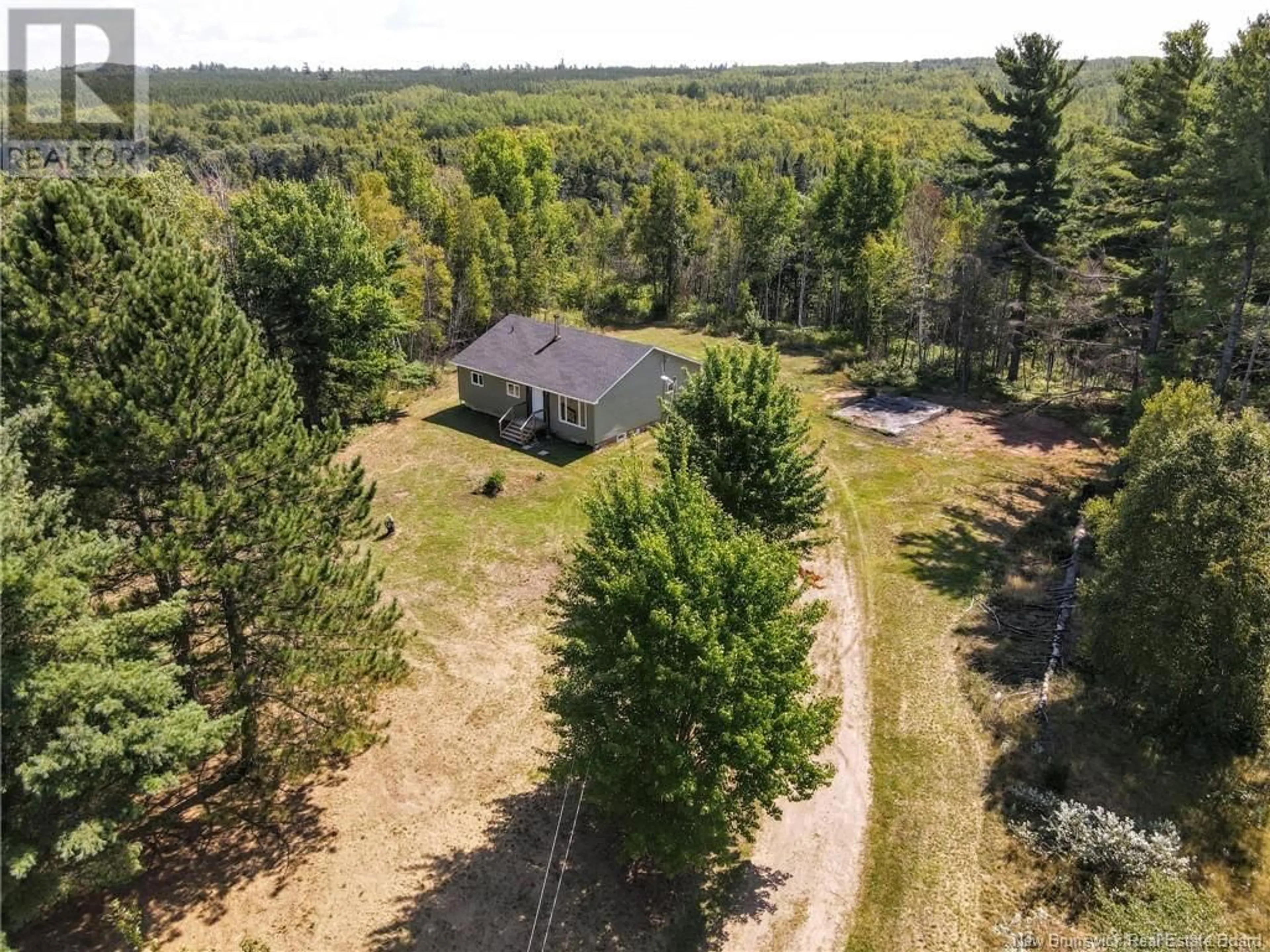 A pic from outside/outdoor area/front of a property/back of a property/a pic from drone, forest/trees view for 7220 ROUTE 112, Hunters Home New Brunswick E4J4J1