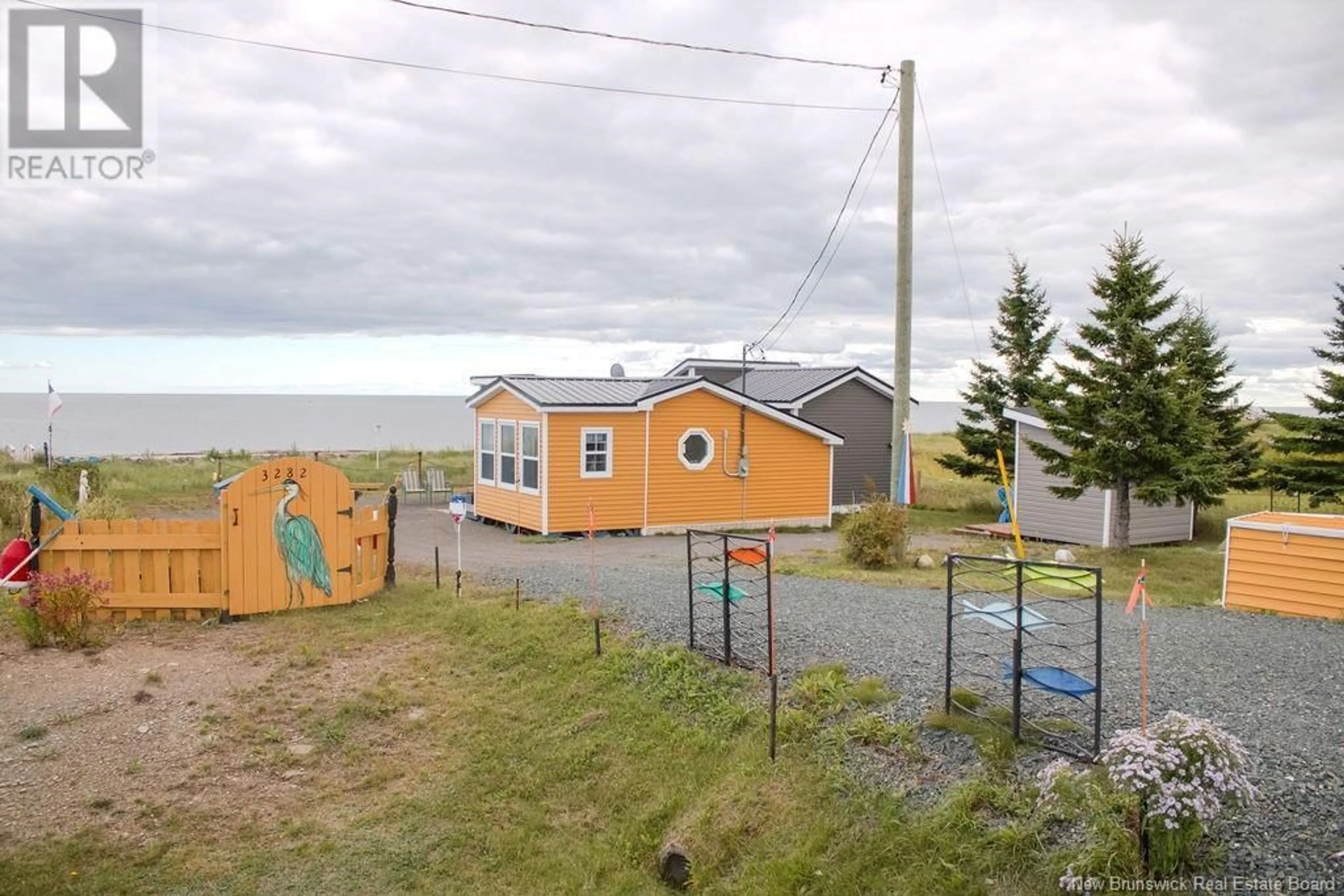 A pic from outside/outdoor area/front of a property/back of a property/a pic from drone, unknown for 3282 ROUTE 117, Pointe-Sapin New Brunswick E9A1T2