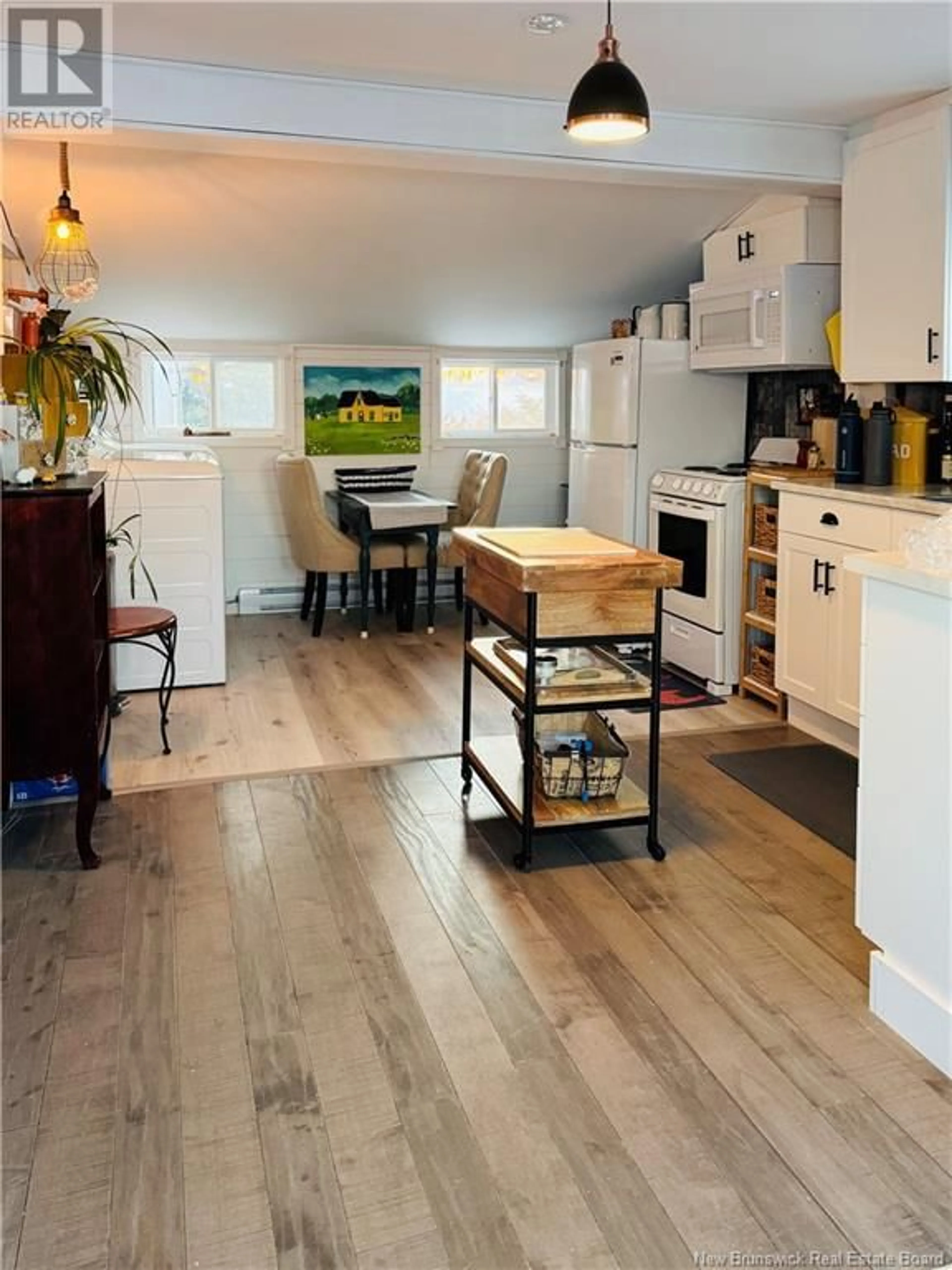 Open concept kitchen, wood/laminate floor for 3282 ROUTE 117, Pointe-Sapin New Brunswick E9A1T2