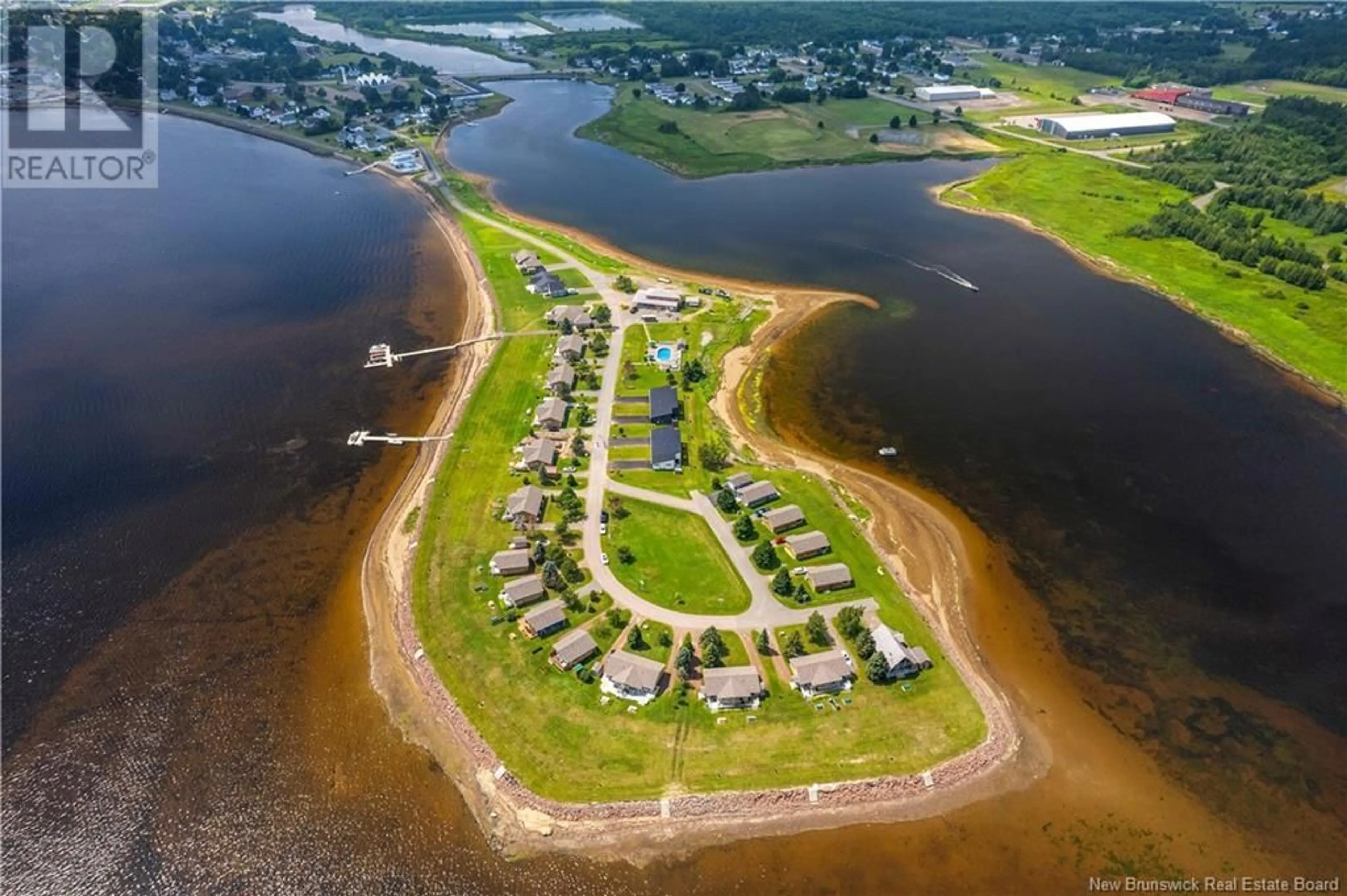 A pic from outside/outdoor area/front of a property/back of a property/a pic from drone, water/lake/river/ocean view for 89-91 YORK, Richibucto New Brunswick E4W4K2