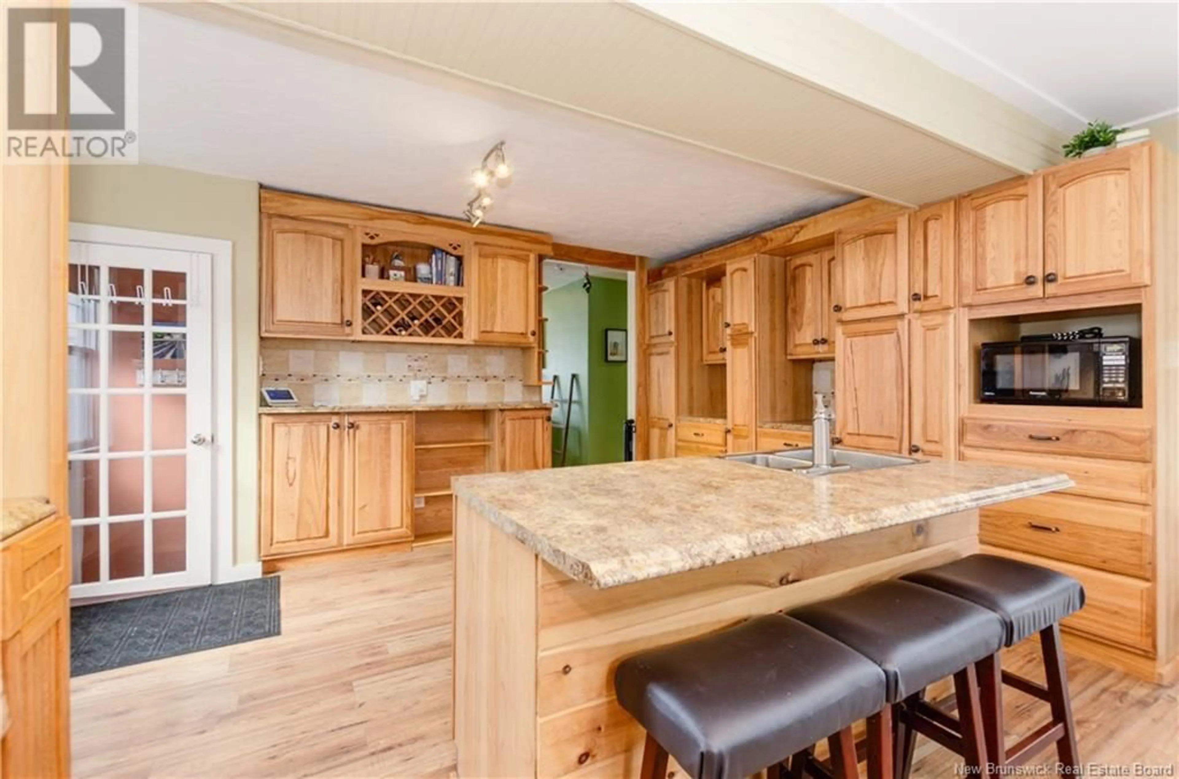 Open concept kitchen, wood/laminate floor for 122 CHESSWOOD DRIVE, Riverview New Brunswick E1B1K4