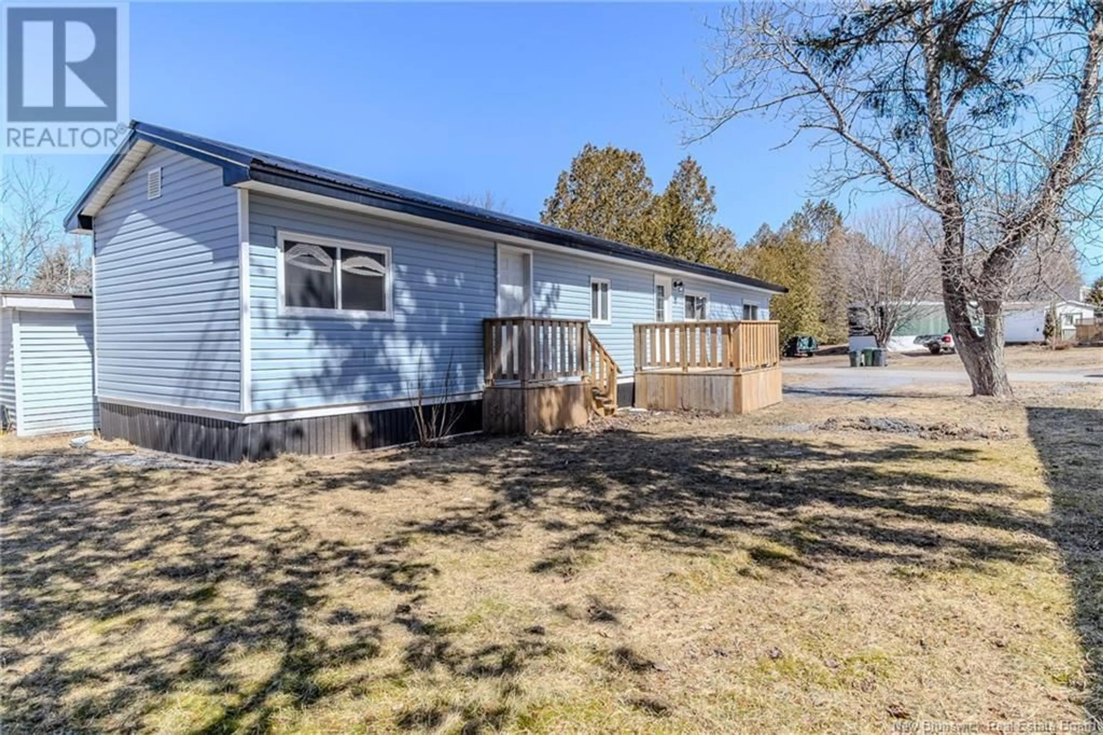 A pic from outside/outdoor area/front of a property/back of a property/a pic from drone, water/lake/river/ocean view for 107 ASH LANE, Quispamsis New Brunswick E2G1T3