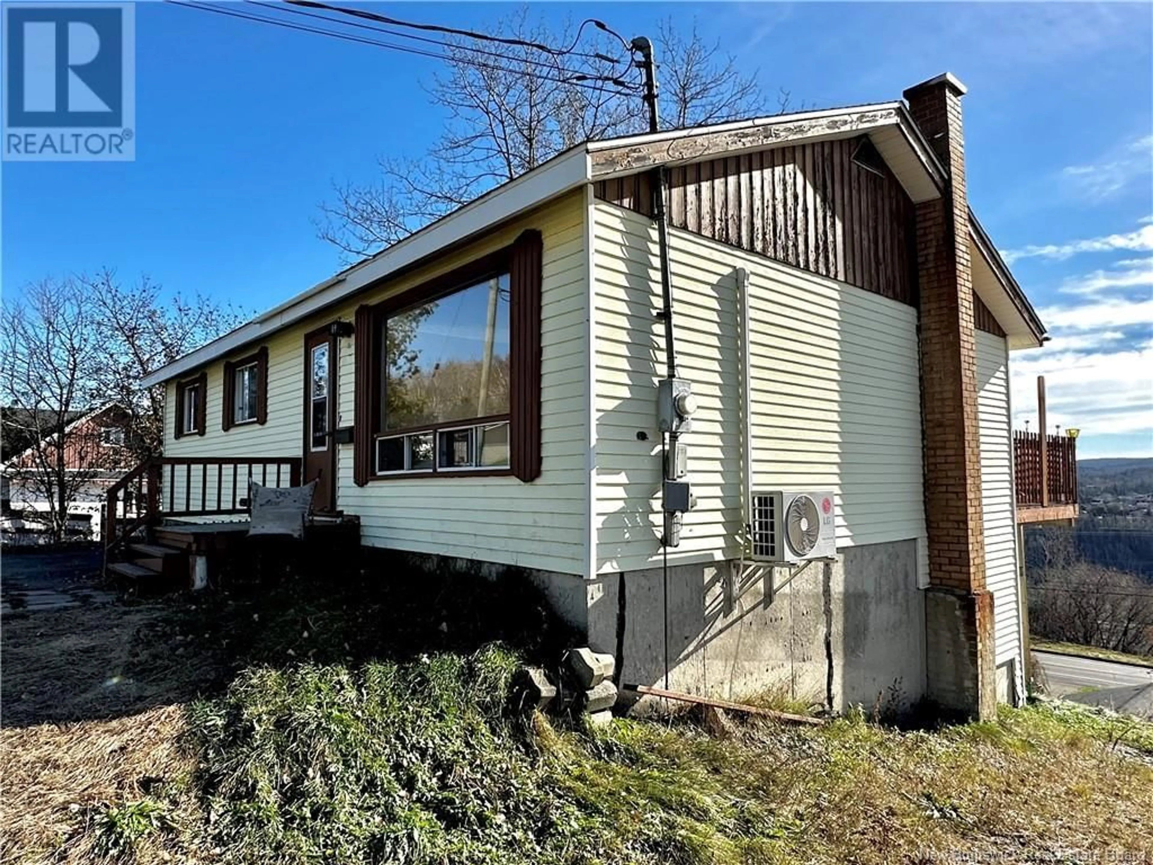 Home with vinyl exterior material, street for 54 CORMIER STREET, Edmundston New Brunswick E3V2E7