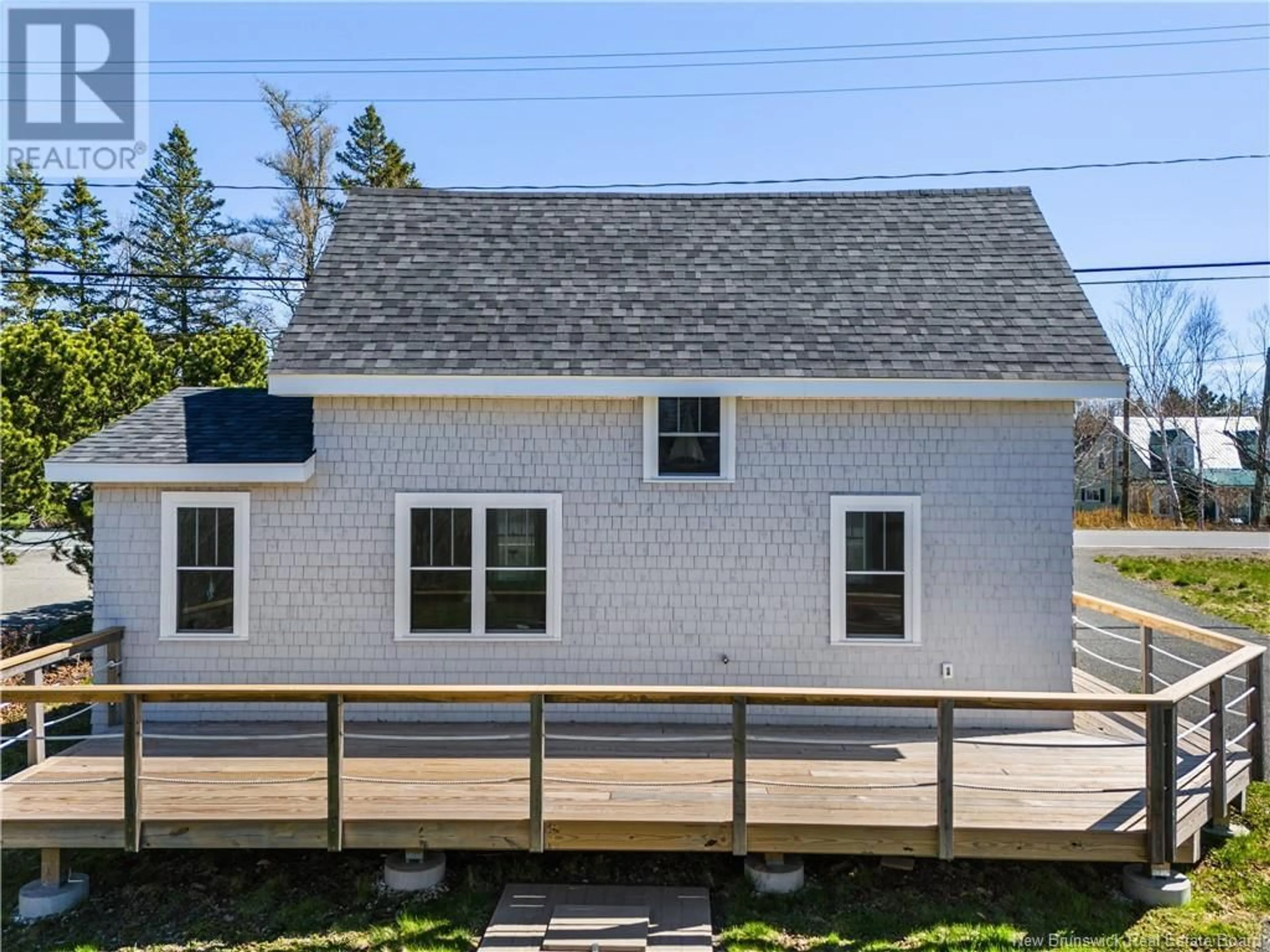 Home with vinyl exterior material, street for 19 NORTH ROAD, Welshpool New Brunswick E5E1C1