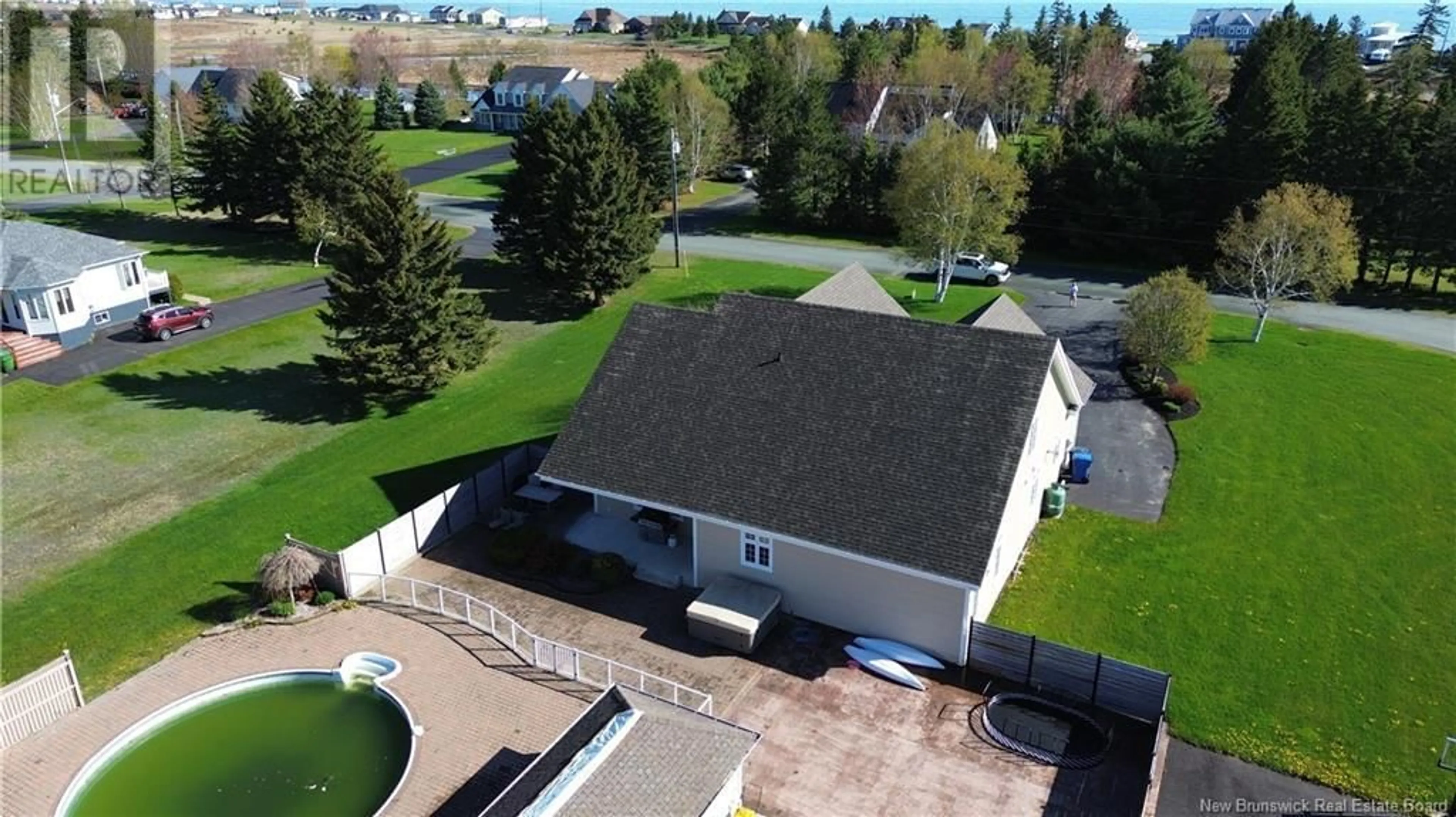 A pic from outside/outdoor area/front of a property/back of a property/a pic from drone, water/lake/river/ocean view for 1240 CHRISTIE STREET, Beresford New Brunswick E8K1A4