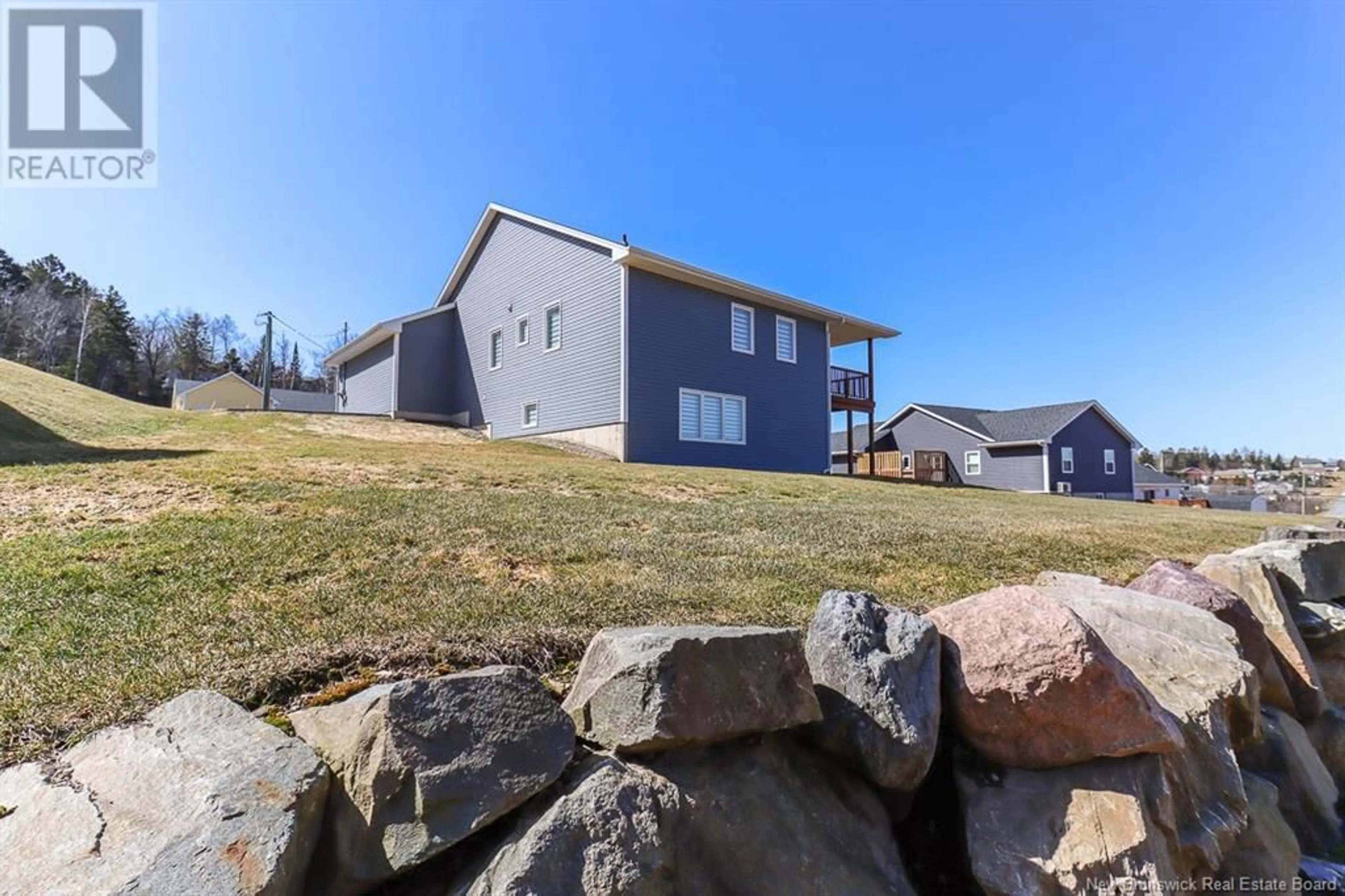 A pic from outside/outdoor area/front of a property/back of a property/a pic from drone, unknown for 15 LACHLAN COURT, Quispamsis New Brunswick E2E0T9