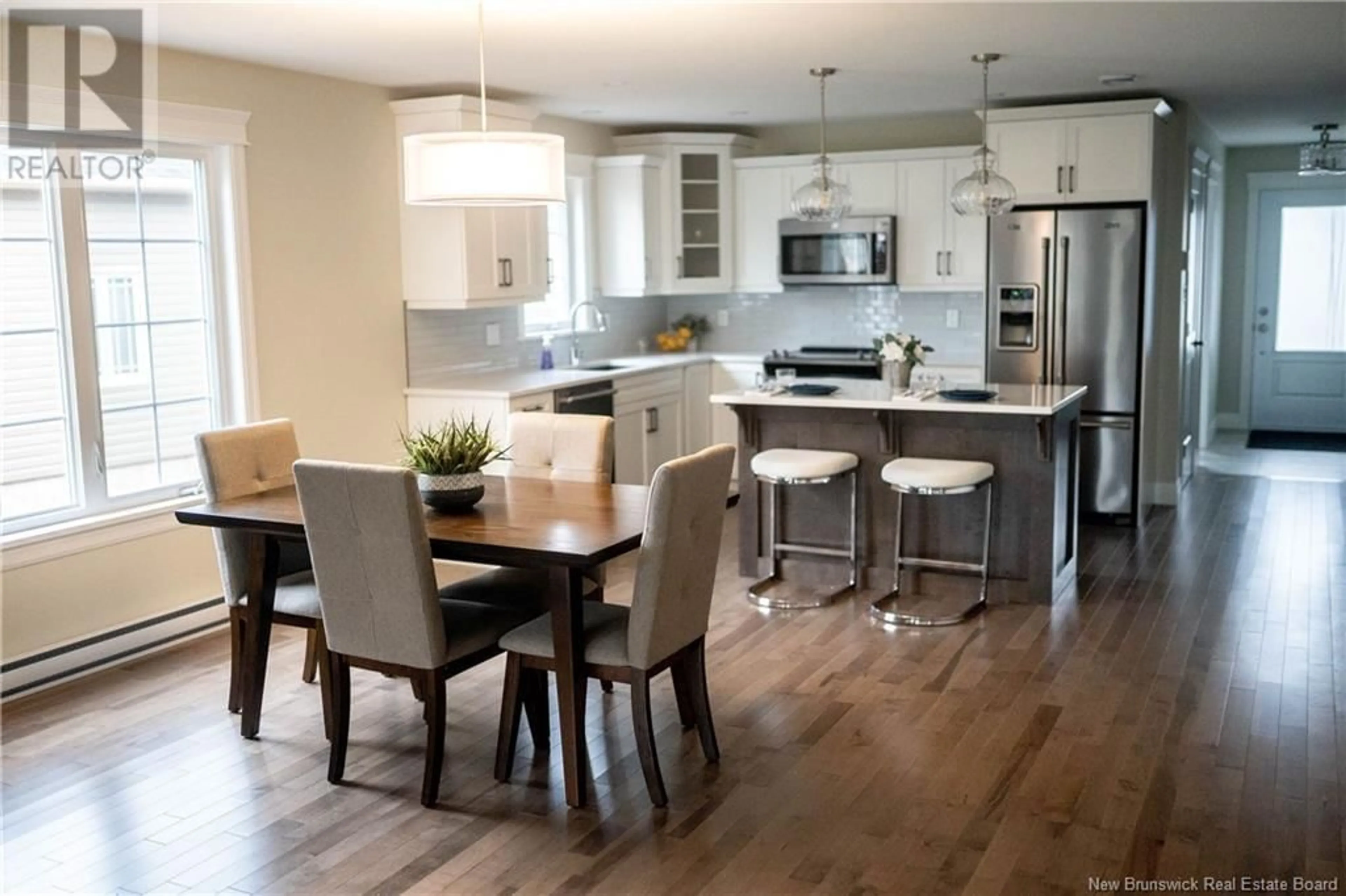 Open concept kitchen, wood/laminate floor for 36 HAMEL DRIVE, Quispamsis New Brunswick E2E4T4