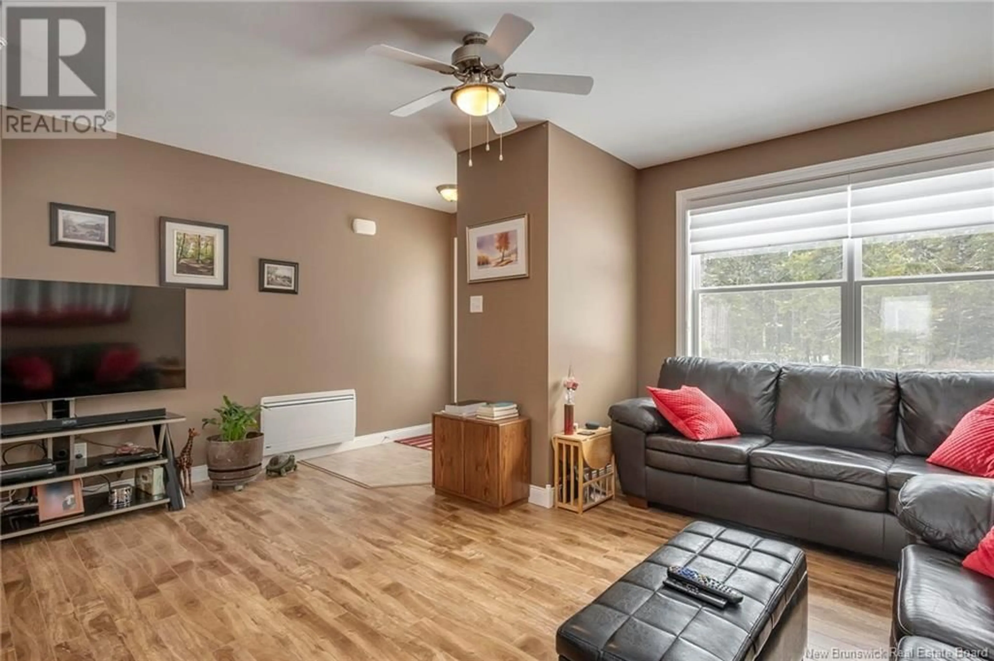 Living room with furniture, wood/laminate floor for 59 MCCARTHY'S POINT ROAD, Pocologan New Brunswick E5J0B7