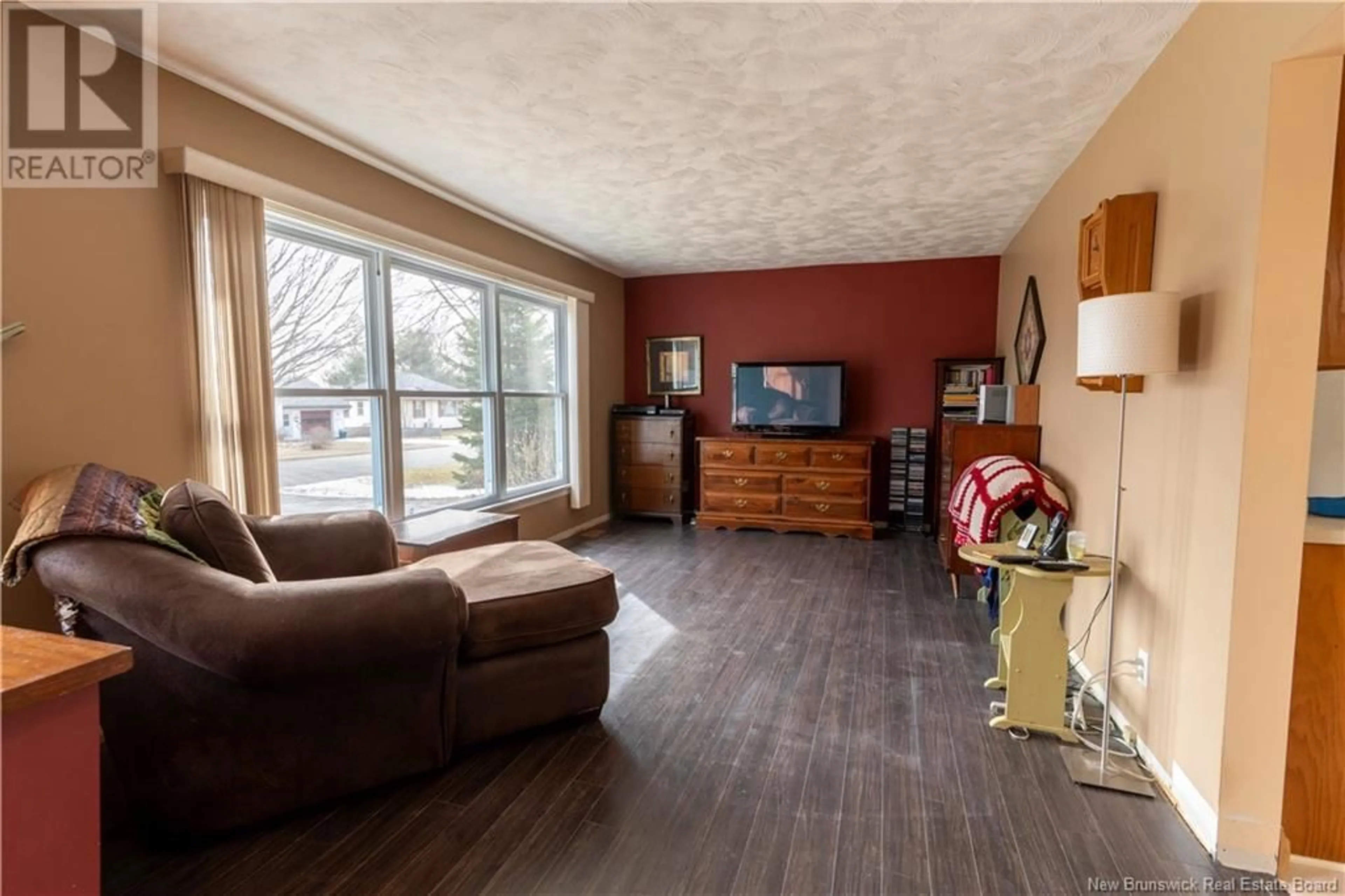 Living room with furniture, wood/laminate floor for 119 WILKINS AVENUE, Fredericton New Brunswick E3A1G1