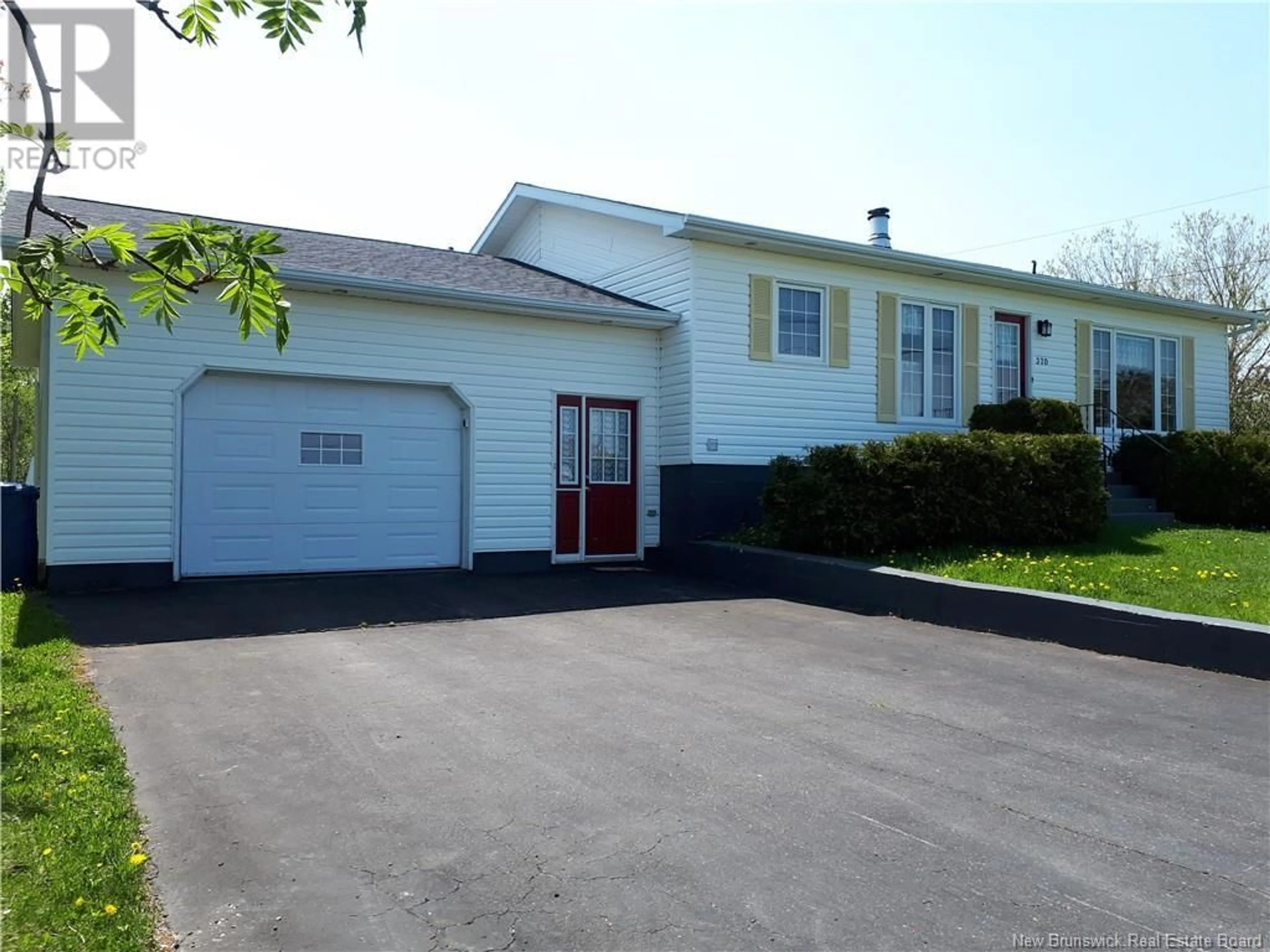 Home with vinyl exterior material, street for 370 FOURNIER, Pointe-Verte New Brunswick E8J2X4