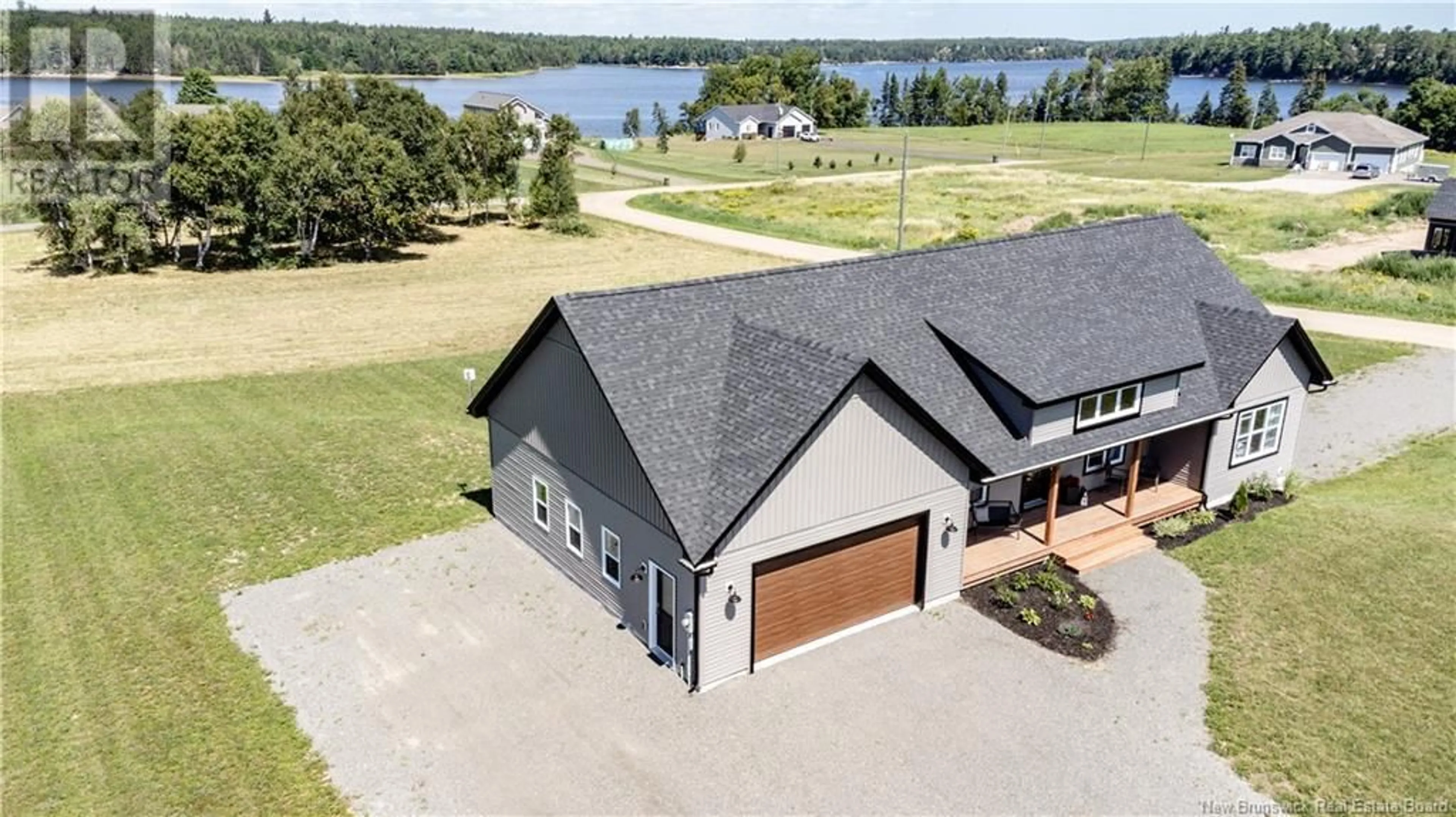 A pic from outside/outdoor area/front of a property/back of a property/a pic from drone, water/lake/river/ocean view for 496 ROUTE 510, Main River New Brunswick E4T1T4