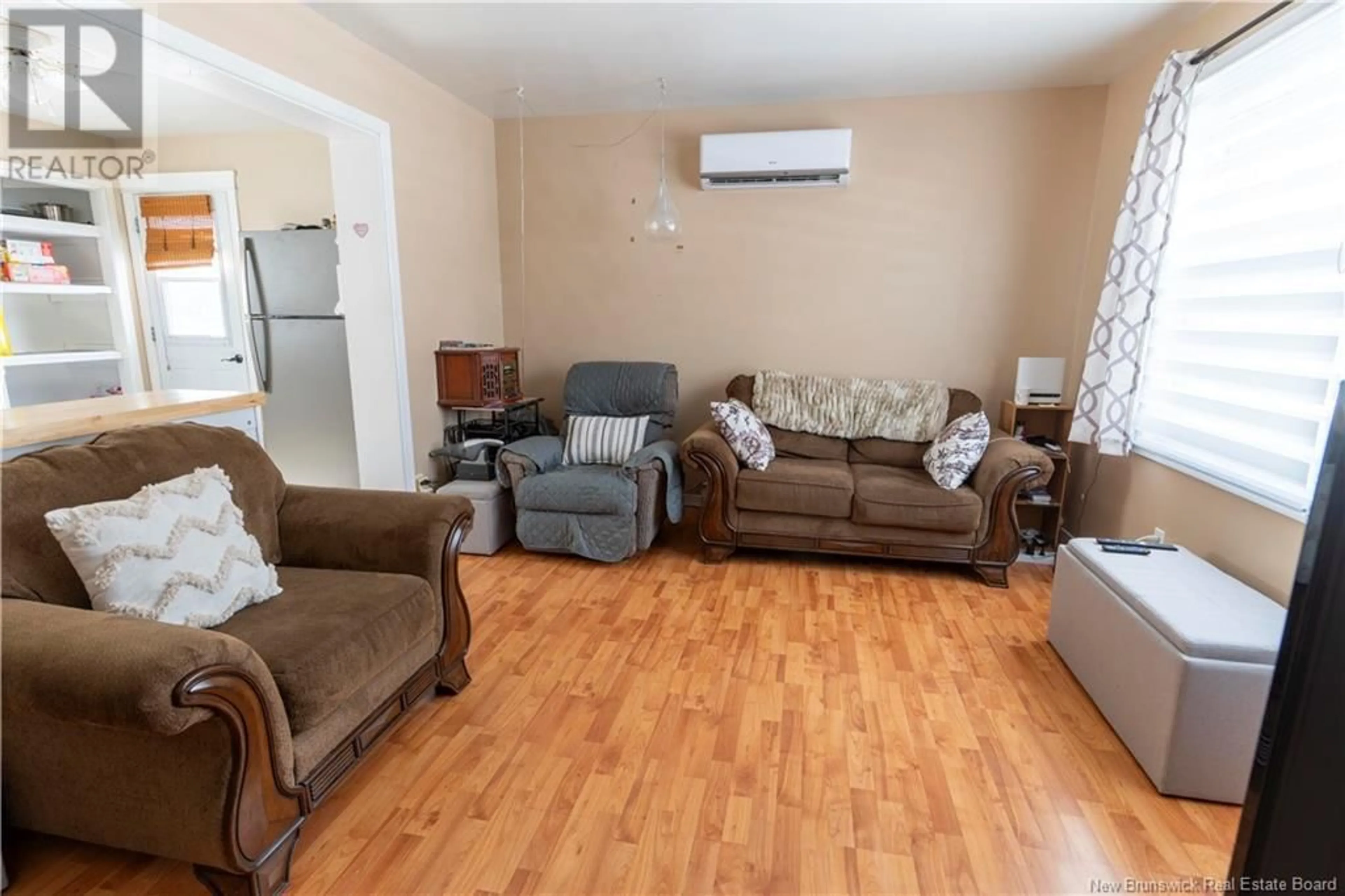 Living room with furniture, wood/laminate floor for 42 NEVILLE STREET, Fredericton New Brunswick E3A4Z5