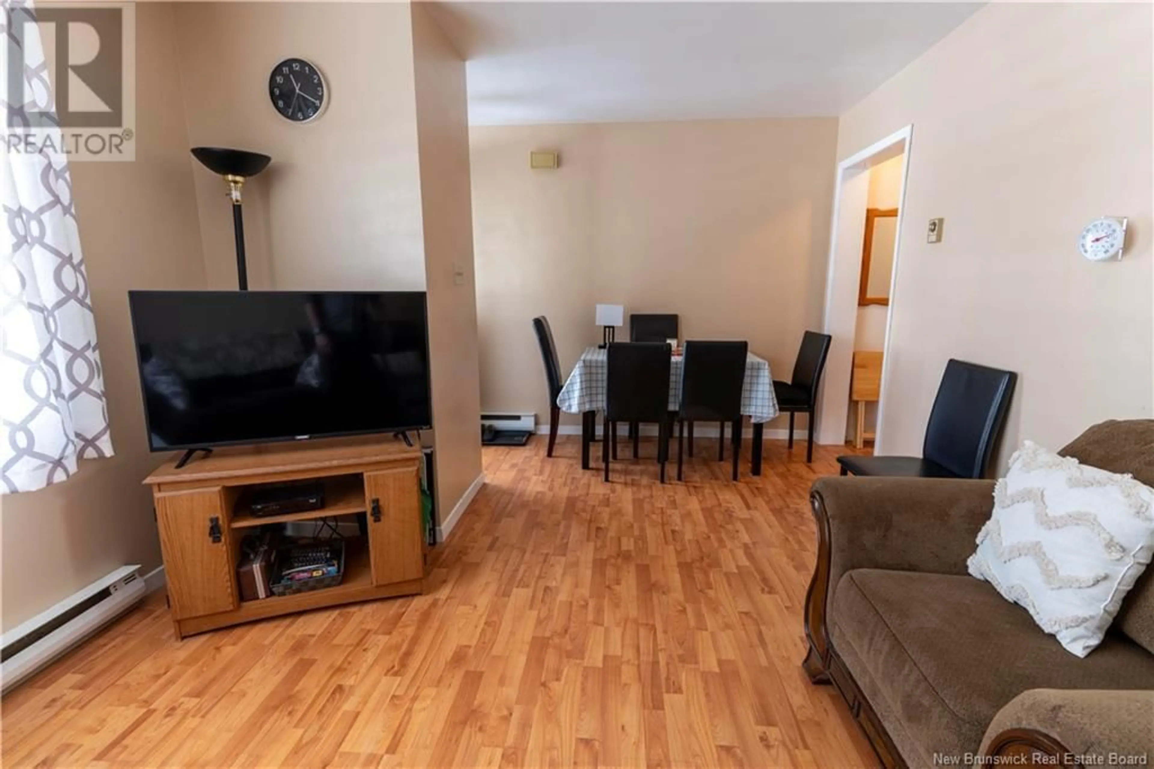 Living room with furniture, wood/laminate floor for 42 NEVILLE STREET, Fredericton New Brunswick E3A4Z5