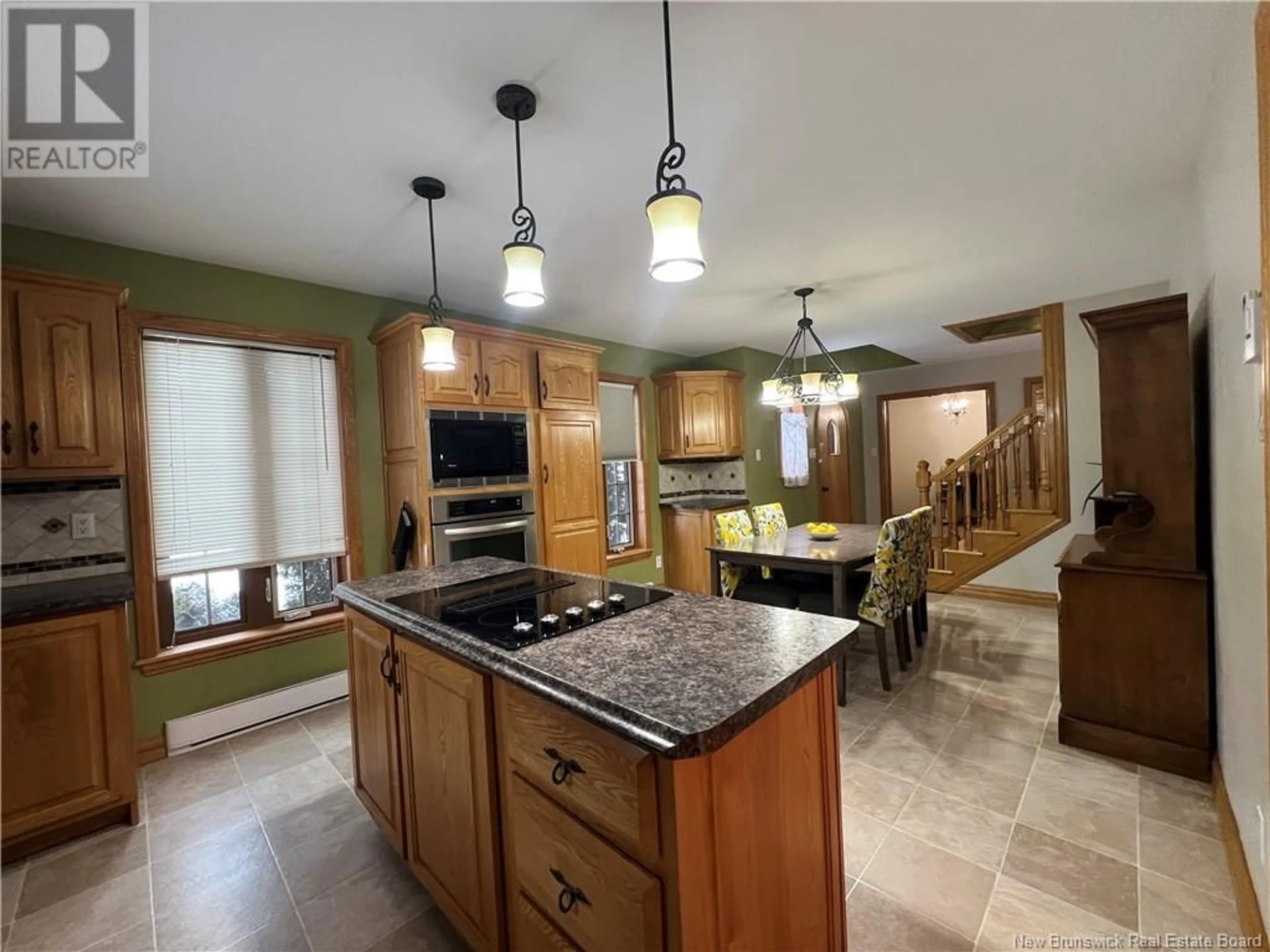 Open concept kitchen, ceramic/tile floor for 24 PAQUIN STREET, Saint-Jacques New Brunswick E7B1V4